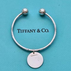Tiffany & Co. Sterling Silver Ball Open Cuff Bracelet with Round Tag Charm