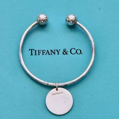 Tiffany & Co. Sterling Silver Ball Screw Cuff Bracelet with Round Tag Charm