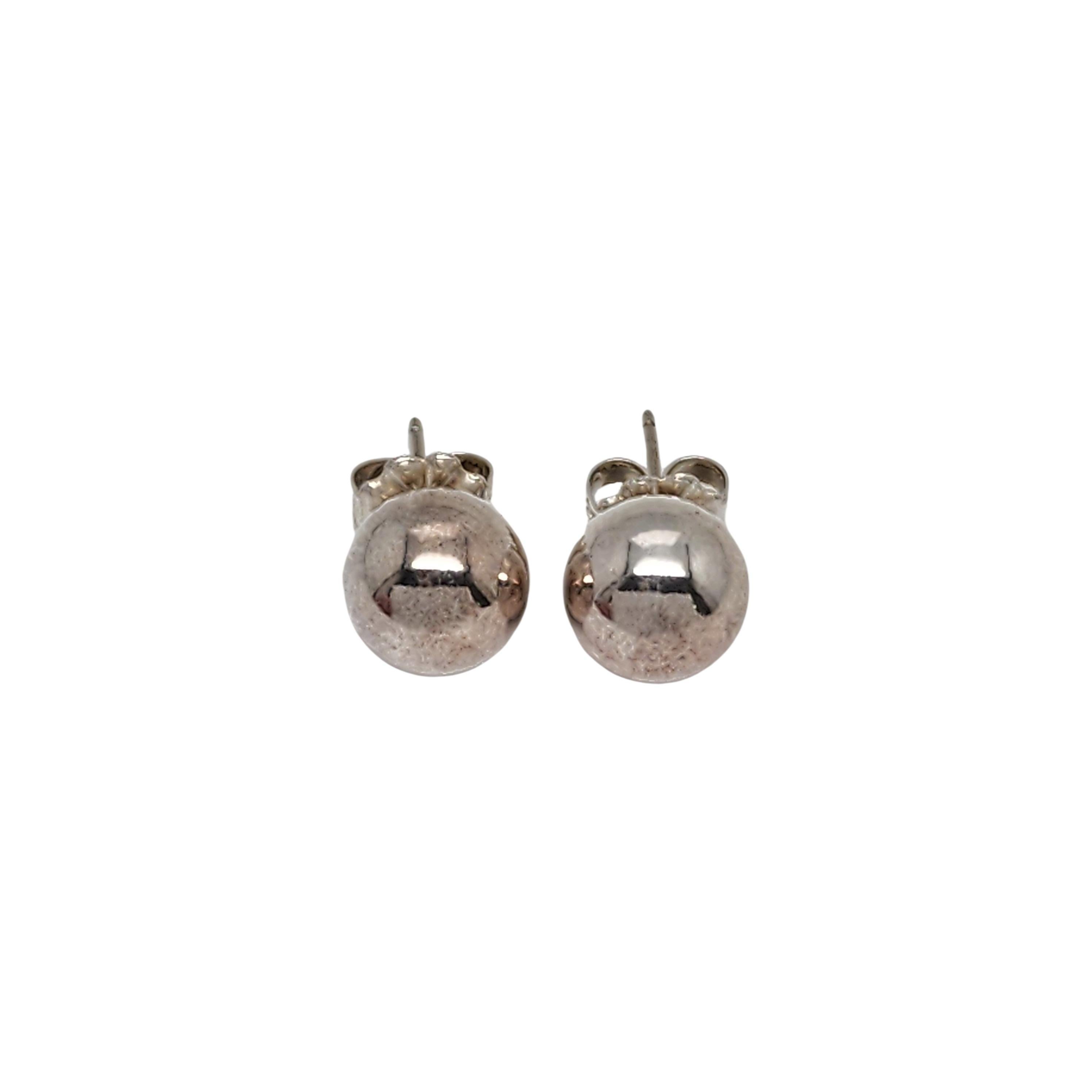 Tiffany & Co sterling silver ball stud earrings 

Authentic Tiffany earrings featuring a classic ball design. The sterling silver earring backs are NOT Tiffany & Co. Tiffany pouch and box are not included.

Measures approx 10mm in diameter.

Weighs