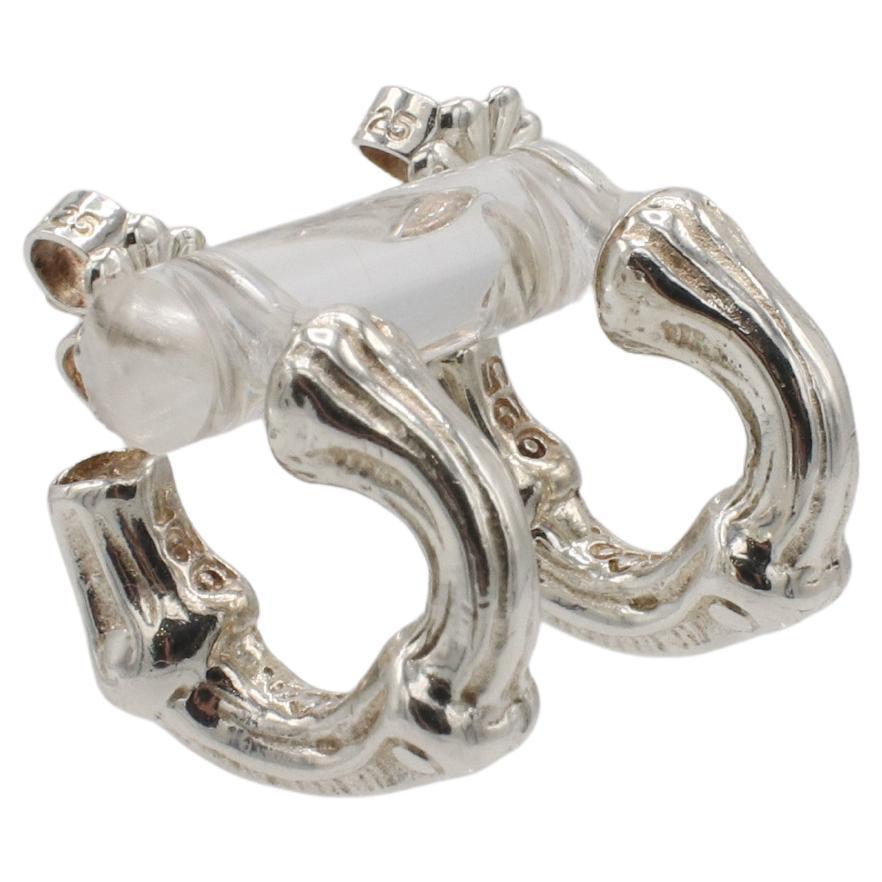 Tiffany & Co. Sterling Silver Bamboo Small Huggie Hoop Earrings 1996
Metal: Sterling silver 925
Weight: 6.04 grams
Diameter: 15mm
Width: 5mm
AT F35000030
