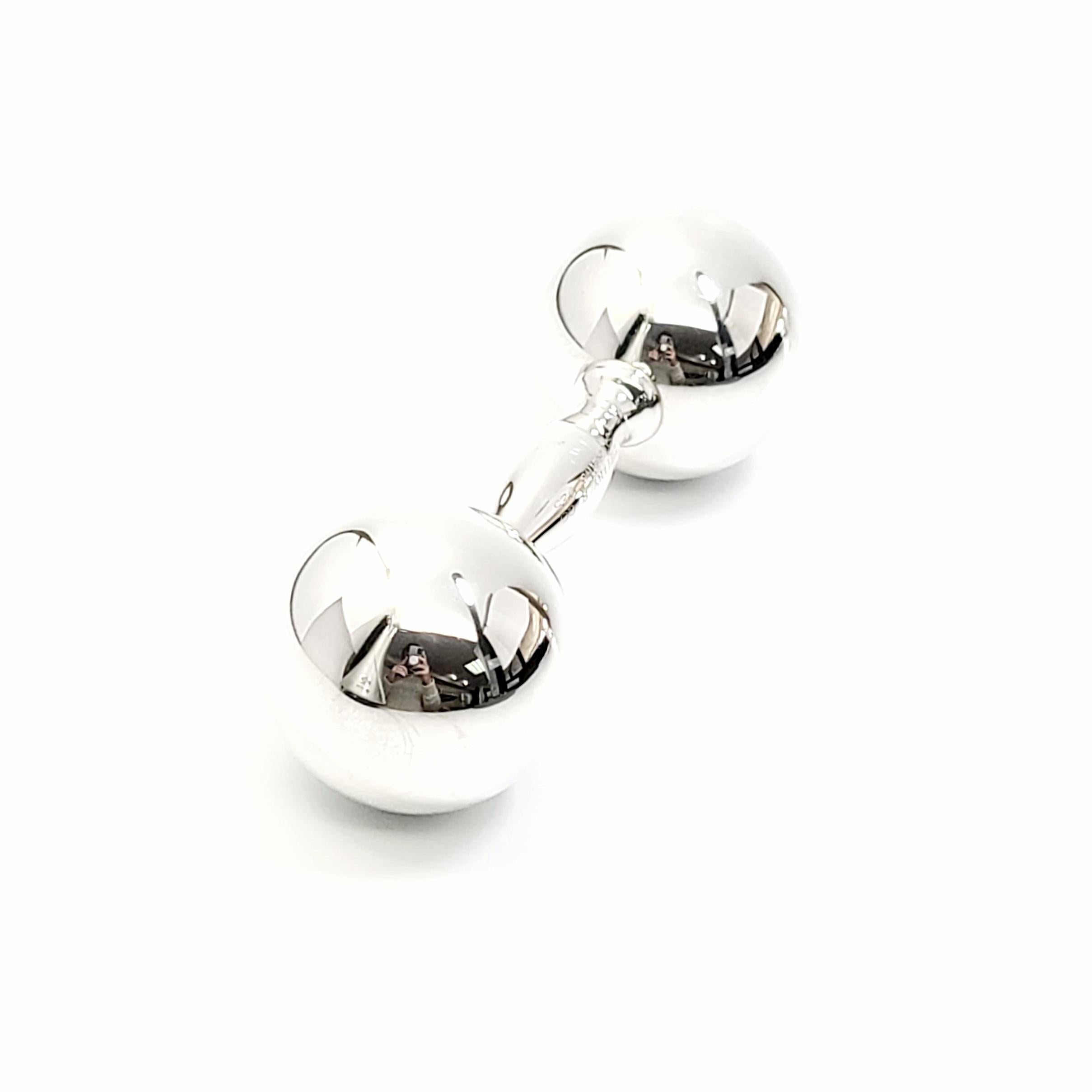 Tiffany & Co sterling silver barbell rattle

This is a beautiful and charming sterling silver dumbbell baby rattle, a classic design by Tiffany & Co. It has a soft sweet jingle when you shake it.

Measures approx 4 1/2