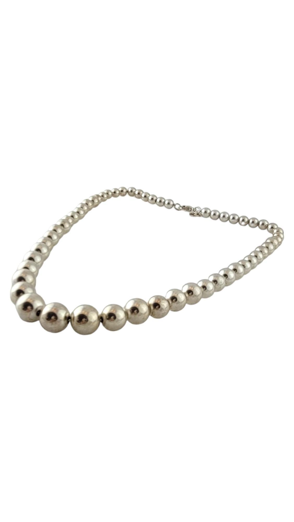 Vintage Tiffany & Co Sterling Silver Bead Necklace

This beautiful sterling silver gradual bead necklace by designer Tiffany & Co. is going to look gorgeous on you!

Length: 15.75