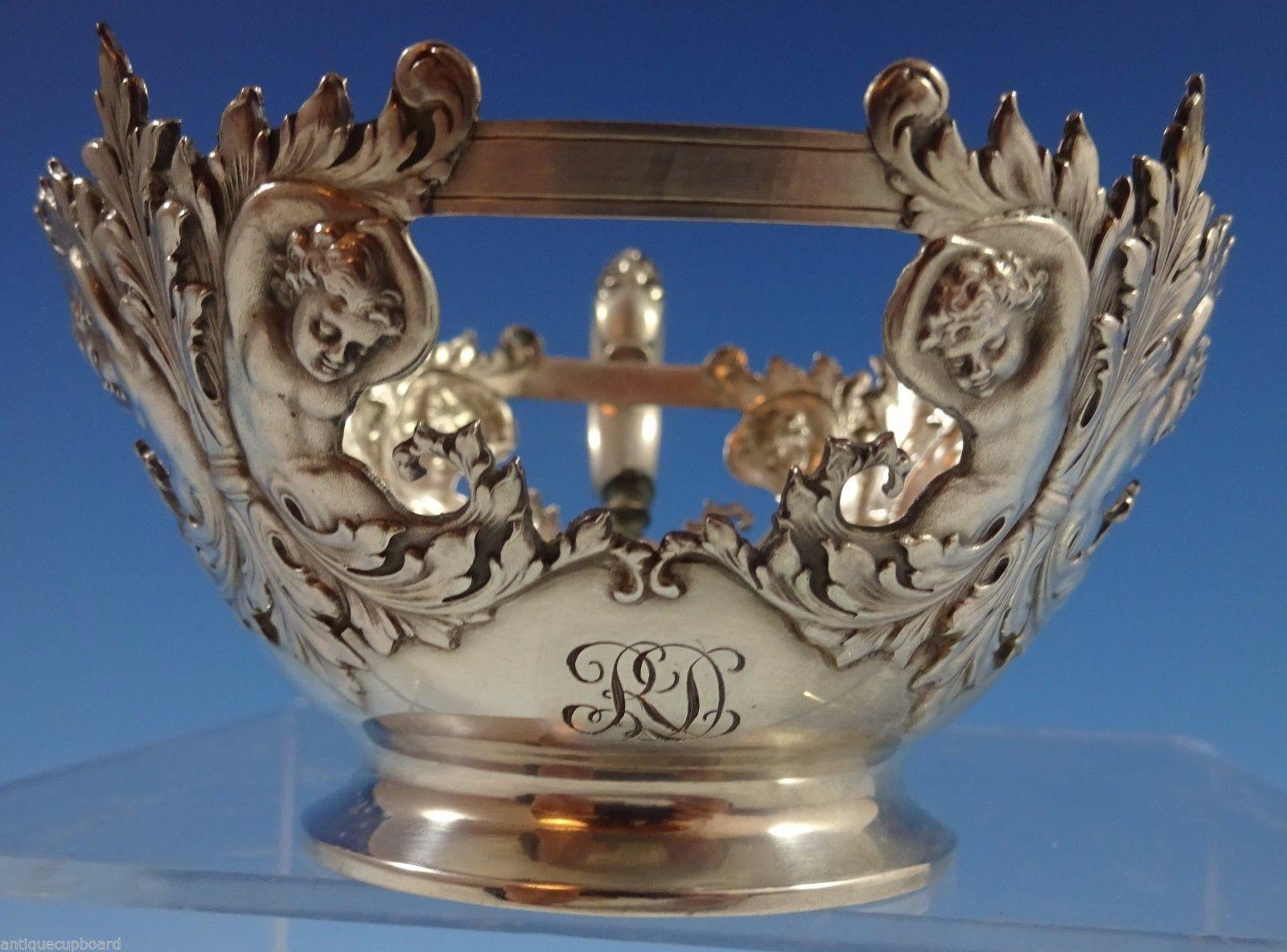 Tiffany & Co.

Figural sterling silver bouillon cup frame made by Tiffany & Co. The cup has fascinating cherubs and has a RD monogram (see photo). The cup measures 2 x 3 1/2 and weighs 2.44 ozt. It is in excellent condition. (does not include a