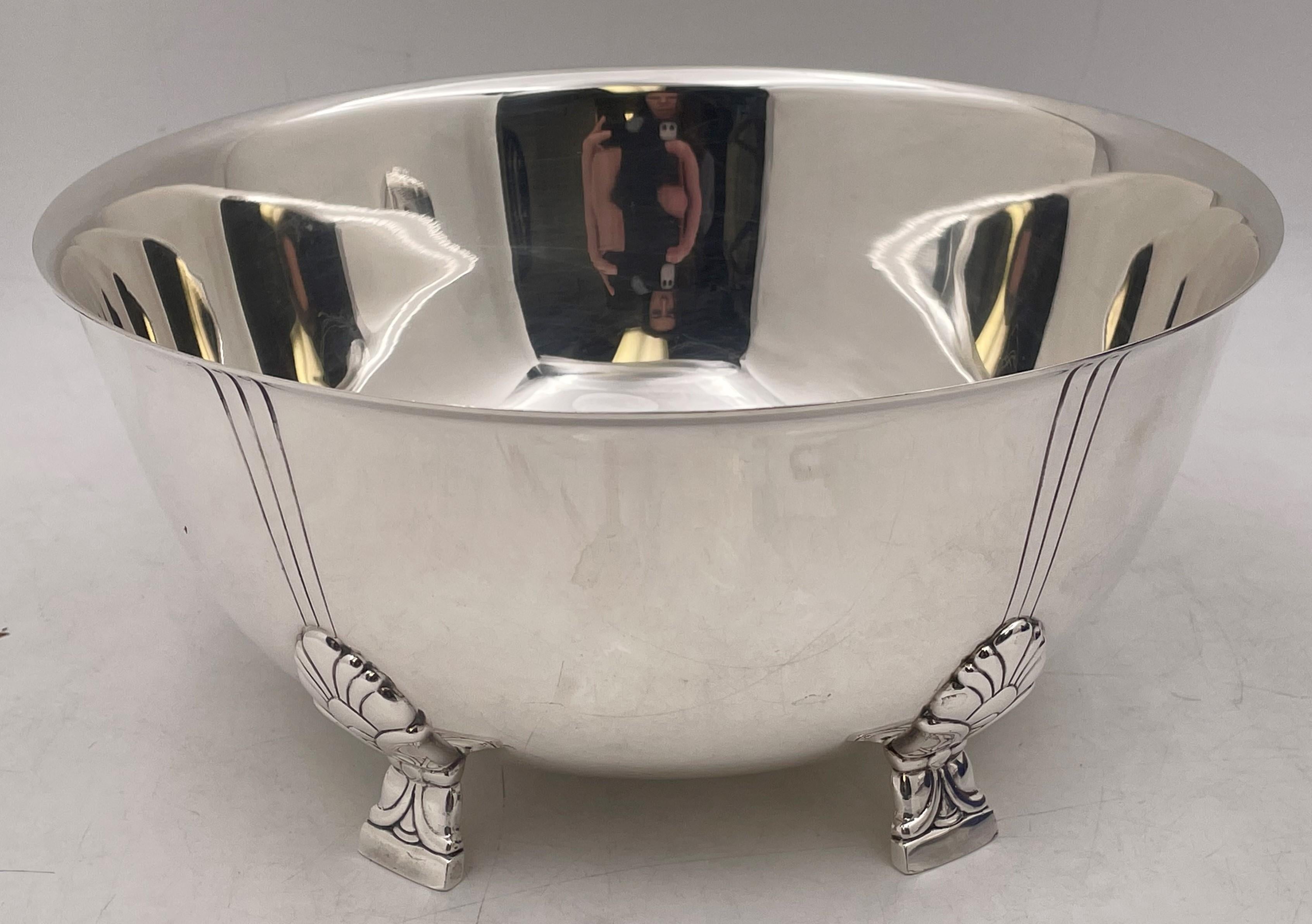 Tiffany & Co., sterling silver bowl, standing on 4 legs showcasing the Palmette pattern, with a beautiful, geometric design in Mid-Century Modern style, in pattern number 23239 from 1947. It measures 10 1/4'' in diameter by 4 3/4'' in height, weighs