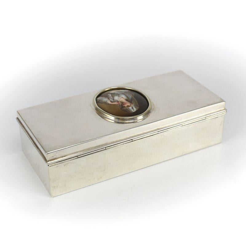 Tiffany & Co. Sterling Silver Box with Porcelain Portrait Plaque, midcentury

Elegant sterling box features a hand painted oval plaque - a young woman dressed in a period costume, holding an oil lamp. The Interior is gilt, and lined with a