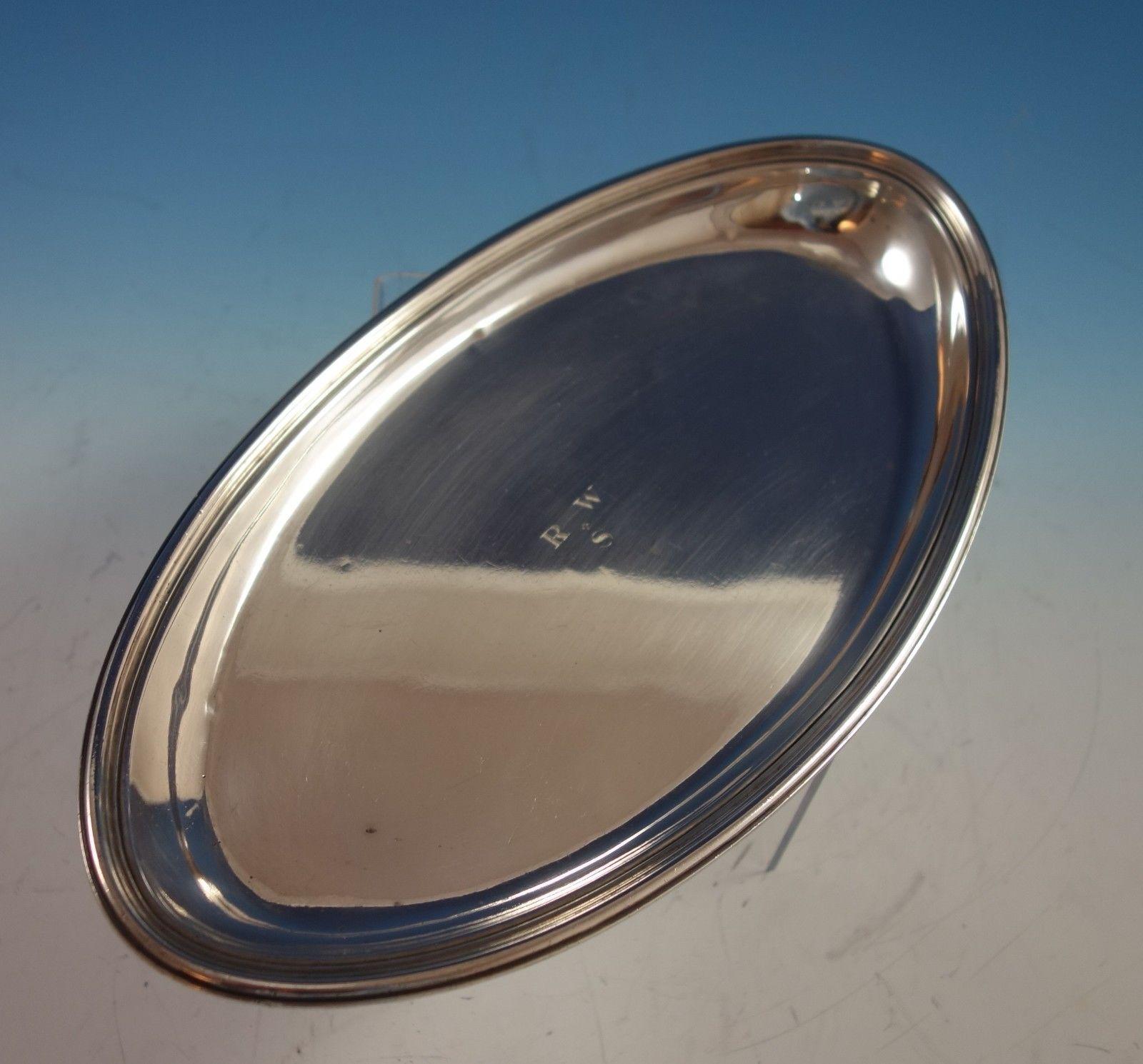 Tiffany & Co. sterling silver oval bread tray. It's marked with #18167 and stylized m for 1907-47. The vintage monogram (see photos) can be removed upon request. The tray measures 1 x 11 5/8 x 6 3/8, and it weighs 14.05 ozt. It is in excellent