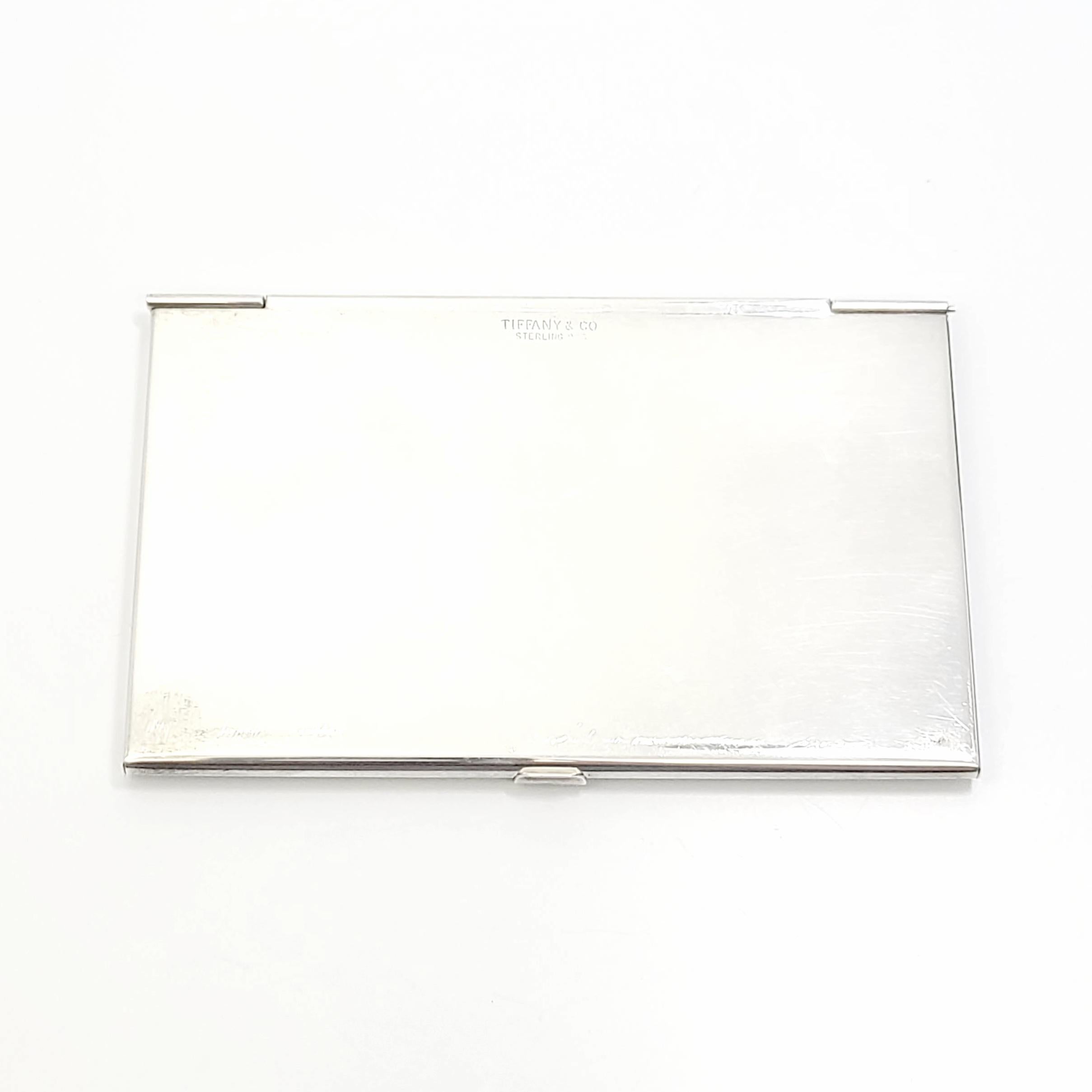 Sterling silver card case by Tiffany & Co.

Monogram appears to be PCS.

This simple and elegant piece features a smooth polished finish with a monogram on the front center. Can hold credit cards or business cards.

Measures 2 1/4
