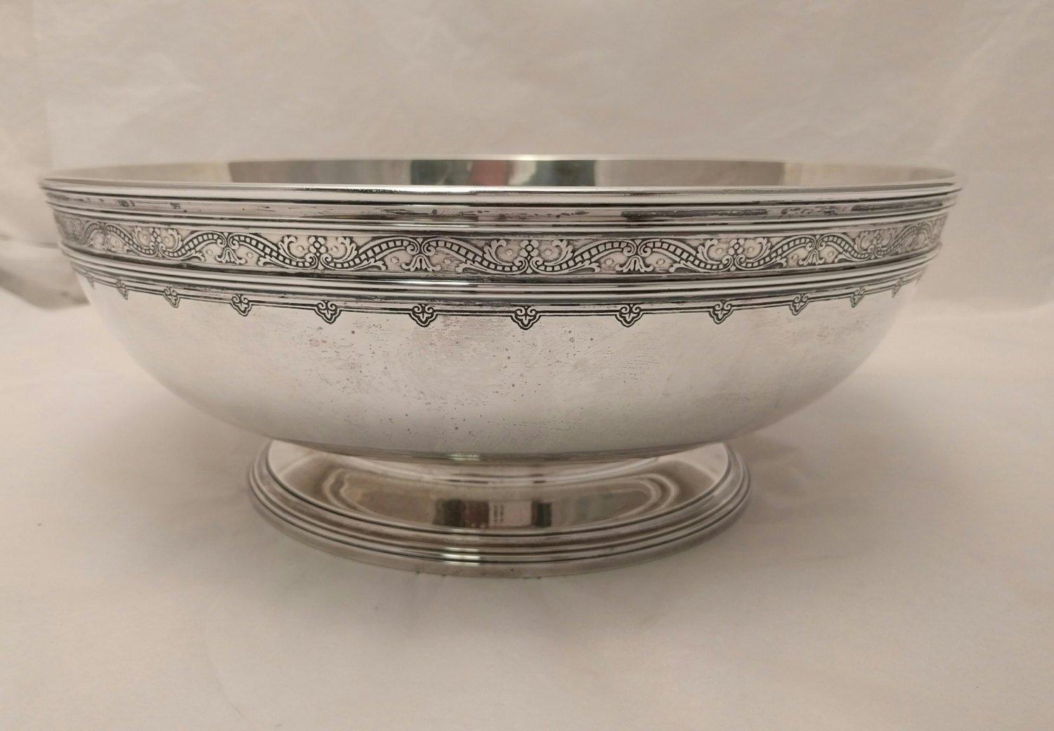Tiffany & Co. sterling silver centerpiece bowl from 1914 in desirable Art Deco style. Measures: Diameter 12 inches, 4.5 inches in height. Approximately 48 ounces. Bears hallmarks as shown.

Founded in 1837 by Charles Lewis Tiffany and John B.