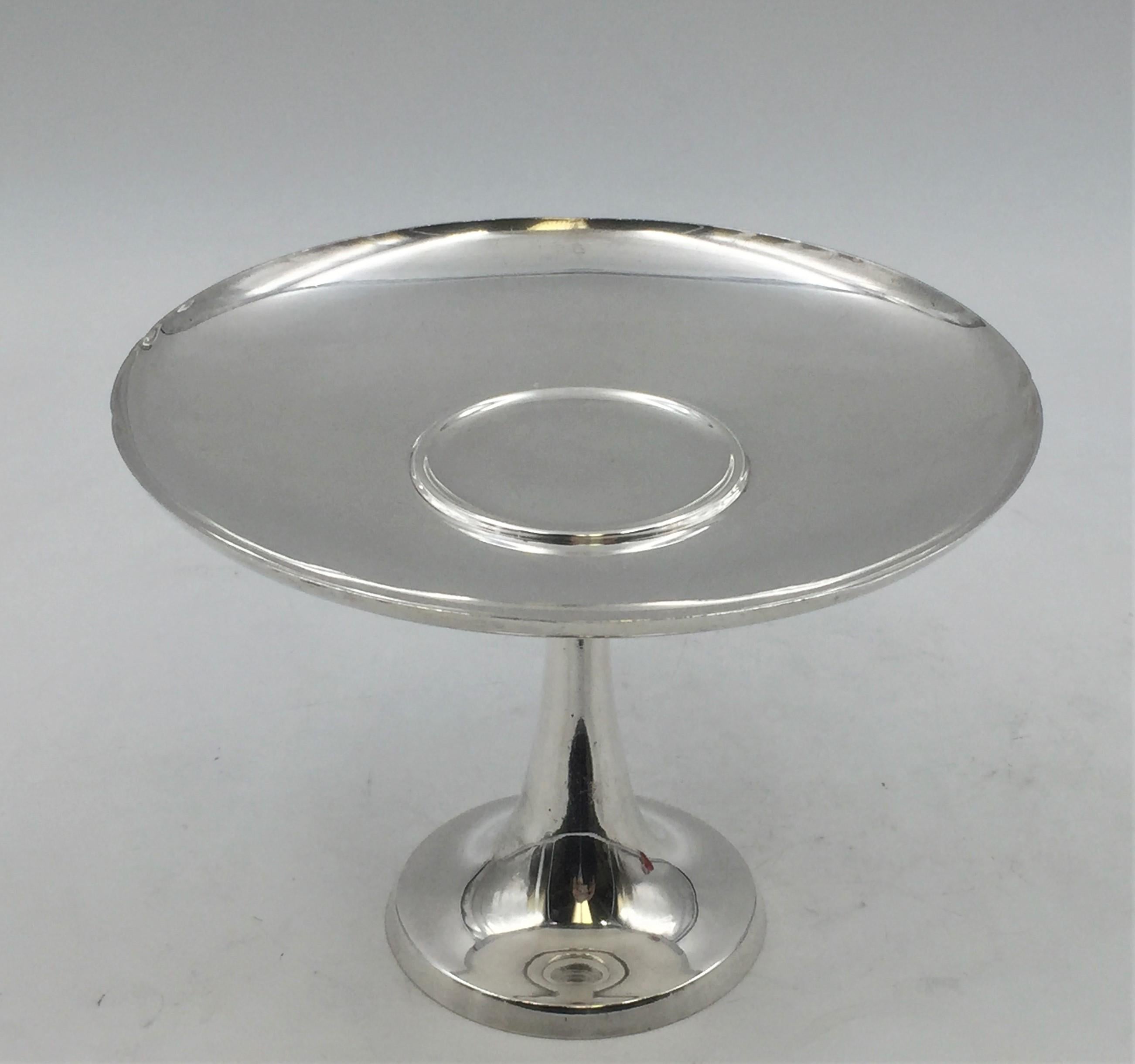 Tiffany & Co. sterling silver centerpiece stand or compote in pattern 23665 from early 1950s and in exquisite Mid-Century Modern style with flowing design. It measures 5 1/2'' in height by 7 2/3'' in diameter, weighs 13.1 ozt, and bears hallmarks as