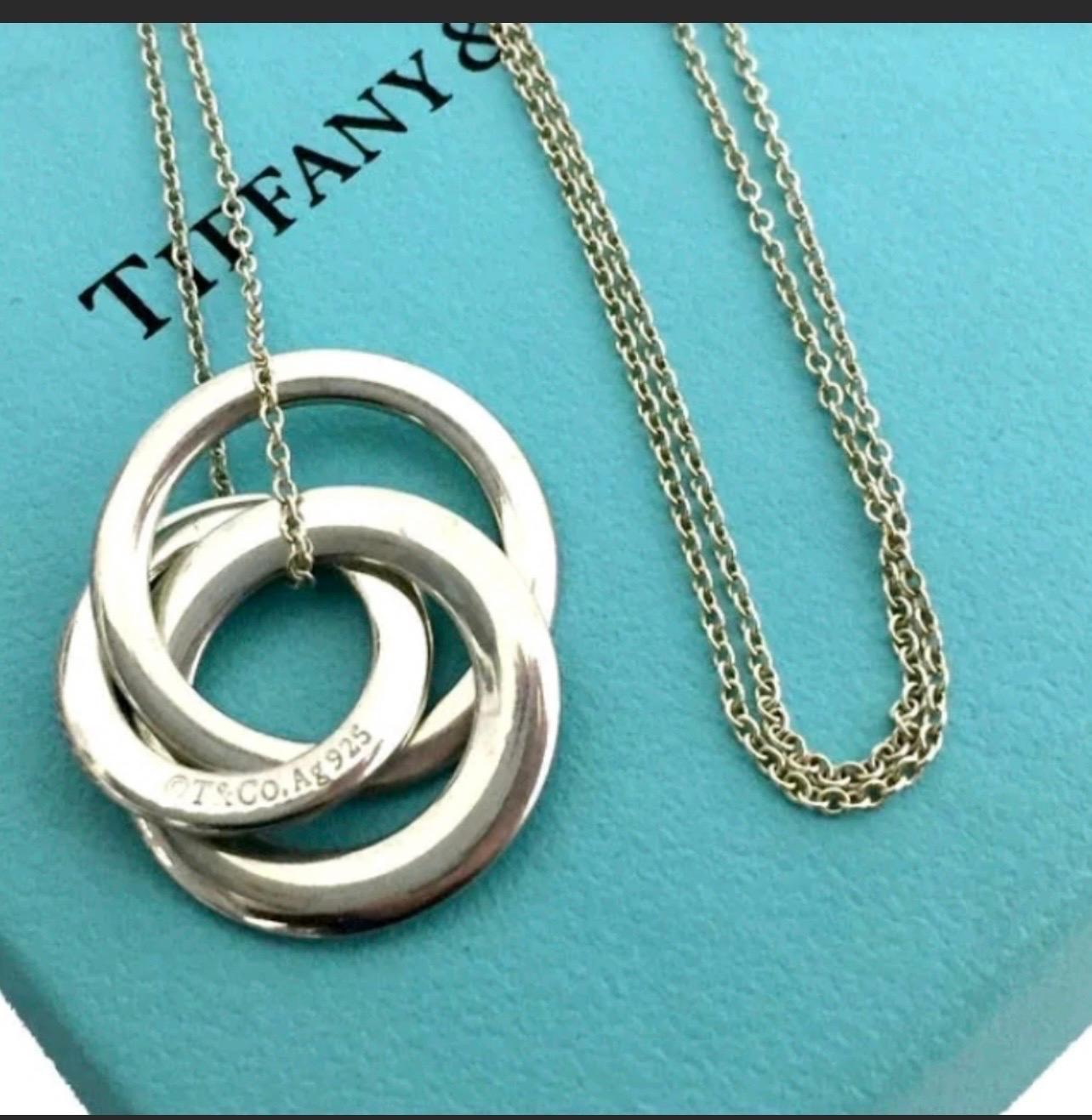 Tiffany & Co 1837 Sterling Silver 3 Interlocking Circles Necklace





This necklace comes complete in a Tiffany & Co pouch presented in a Tiffany & Co gift box and finished with a white ribbon... A perfect gift!!



This is a specially 