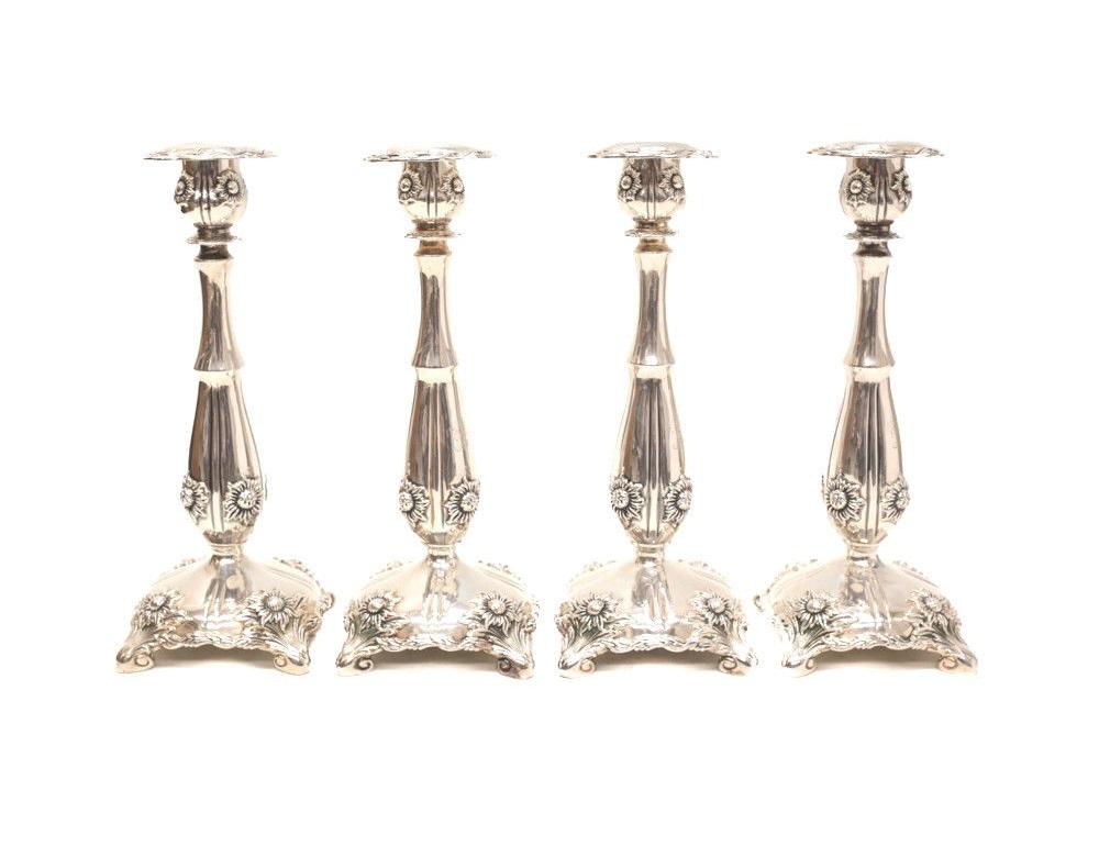 4 Tiffany & Co sterling silver Chrysanthemum candlesticks, circa 1920. This iconic pattern was designed by the famed Tiffany designer, Charles Grosjean. Each with a lovely matching Knight etching. Tiffany marks to the underside base. 

Weight