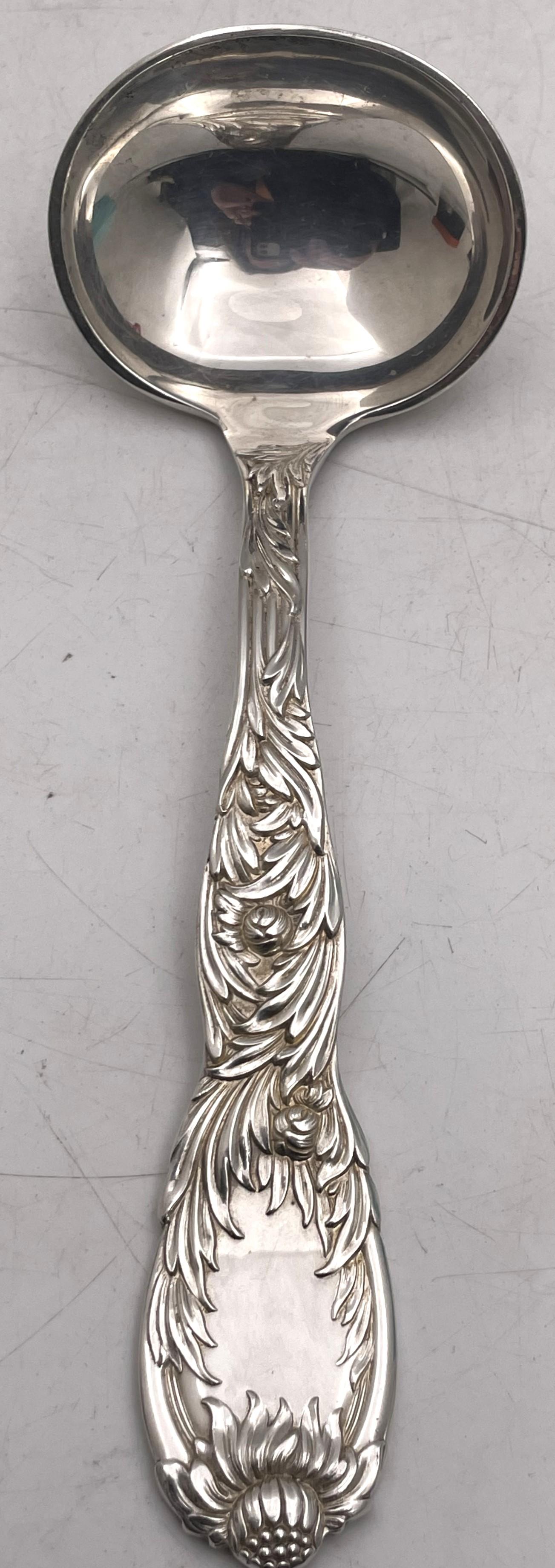 Tiffany & Co. sterling silver gravy ladle in the celebrated Chrysanthemum pattern, beautifully adorned with chrysanthemum flowers on both sides, measuring 7'' in length, and bearing hallmarks as shown.

Designed by Charles Grosjean and released in