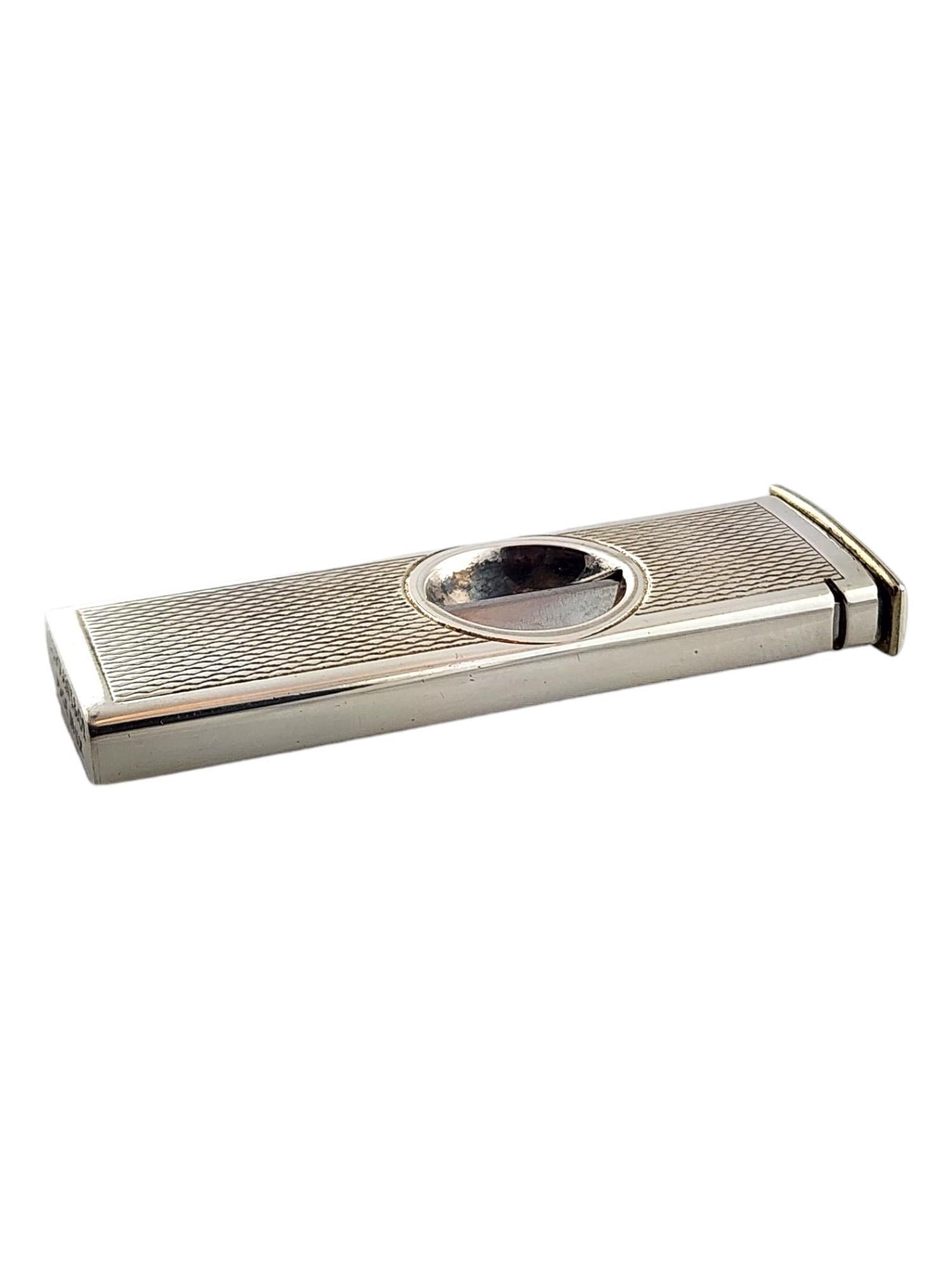Tiffany & Co Sterling Silver Cigar Clipper

This beautiful cigar clipper was meticulously crafted from sterling silver by amazing designer Tiffany & Co!

Size: 53.2mm X 18.4mm X 6.7m

Weight: 8.0 dwt/ 12.6 g

Hallmark: Tiffany & Co Made in UK 7460
