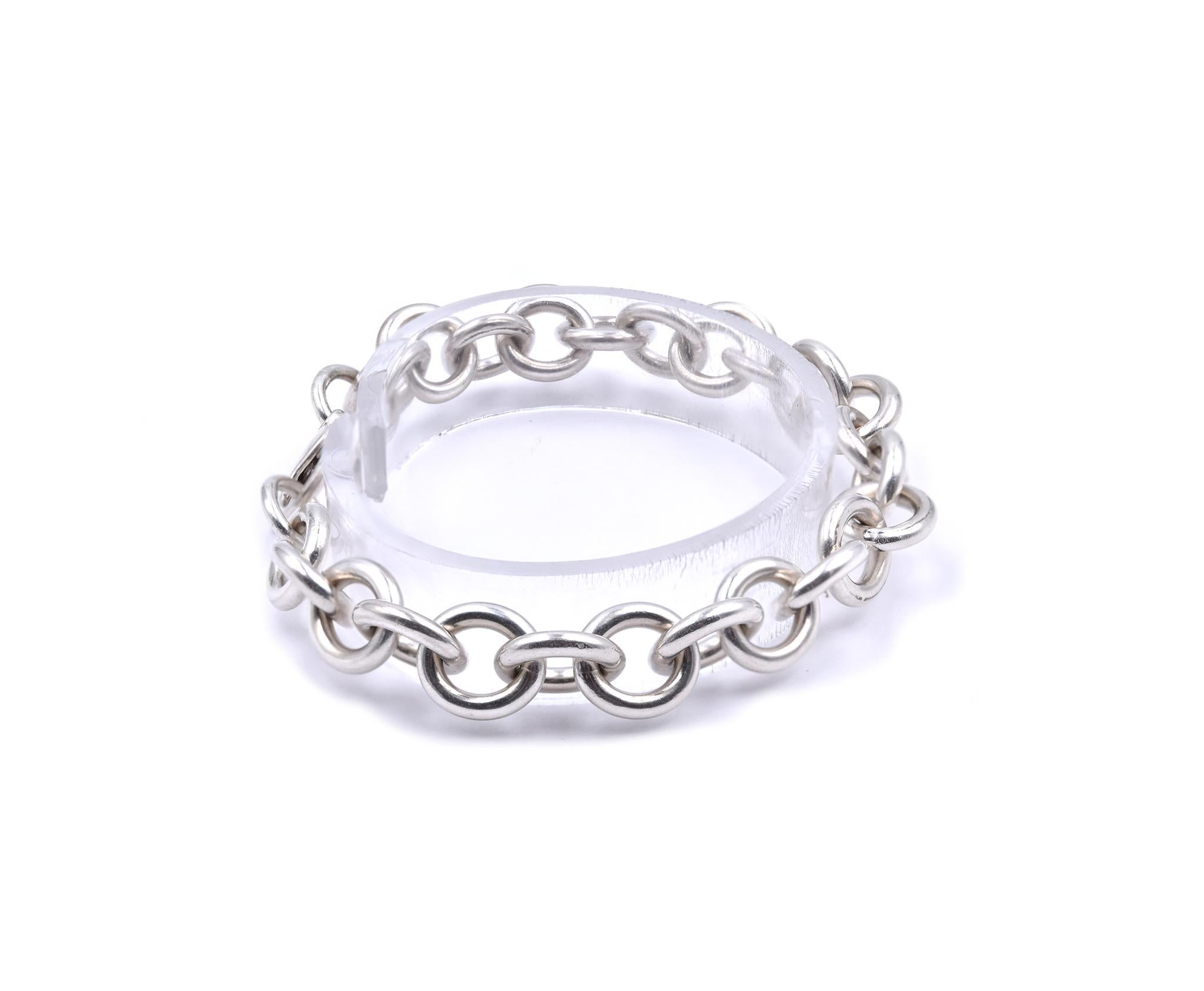 Designer: Tiffany & Co. 
Material: sterling silver
Dimensions: bracelet will fit up to a 7.25-inch wrist
Weight: 28.04 grams
