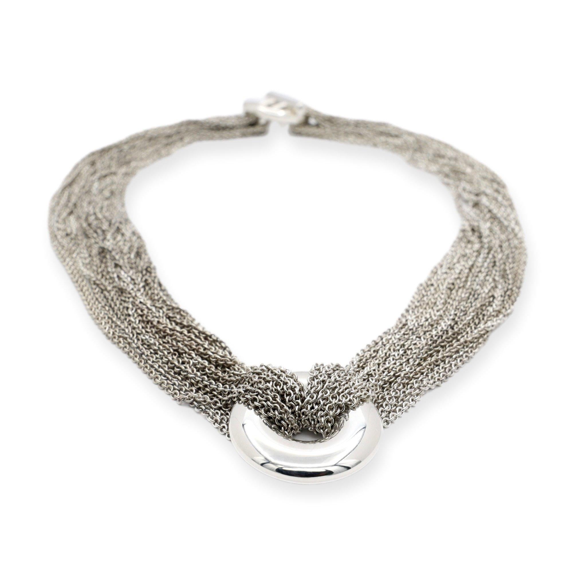 Tiffany & Co. choker necklace finely crafted in sterling silver featuring 20 strands of a mesh cable chain with a circle pendant slide in the center. Necklace has a toggle closure and a 16 inch length. Fully hallmarked with logo and metal