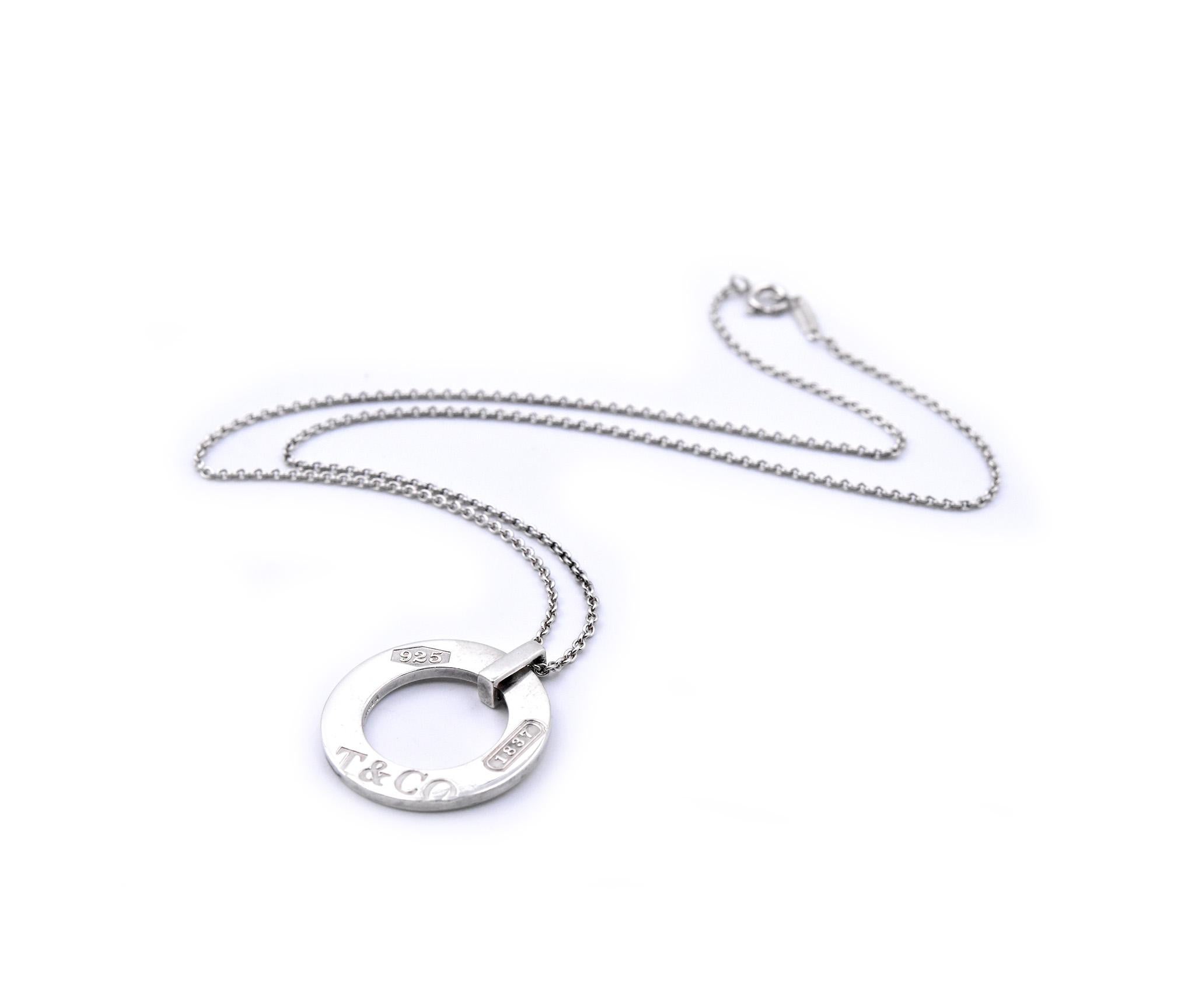 Designer: Tiffany & Co.
Material: sterling silver
Dimensions: necklace is 16 inches long and pendant measures 24mm in diameter
Weight: 7.38 grams
