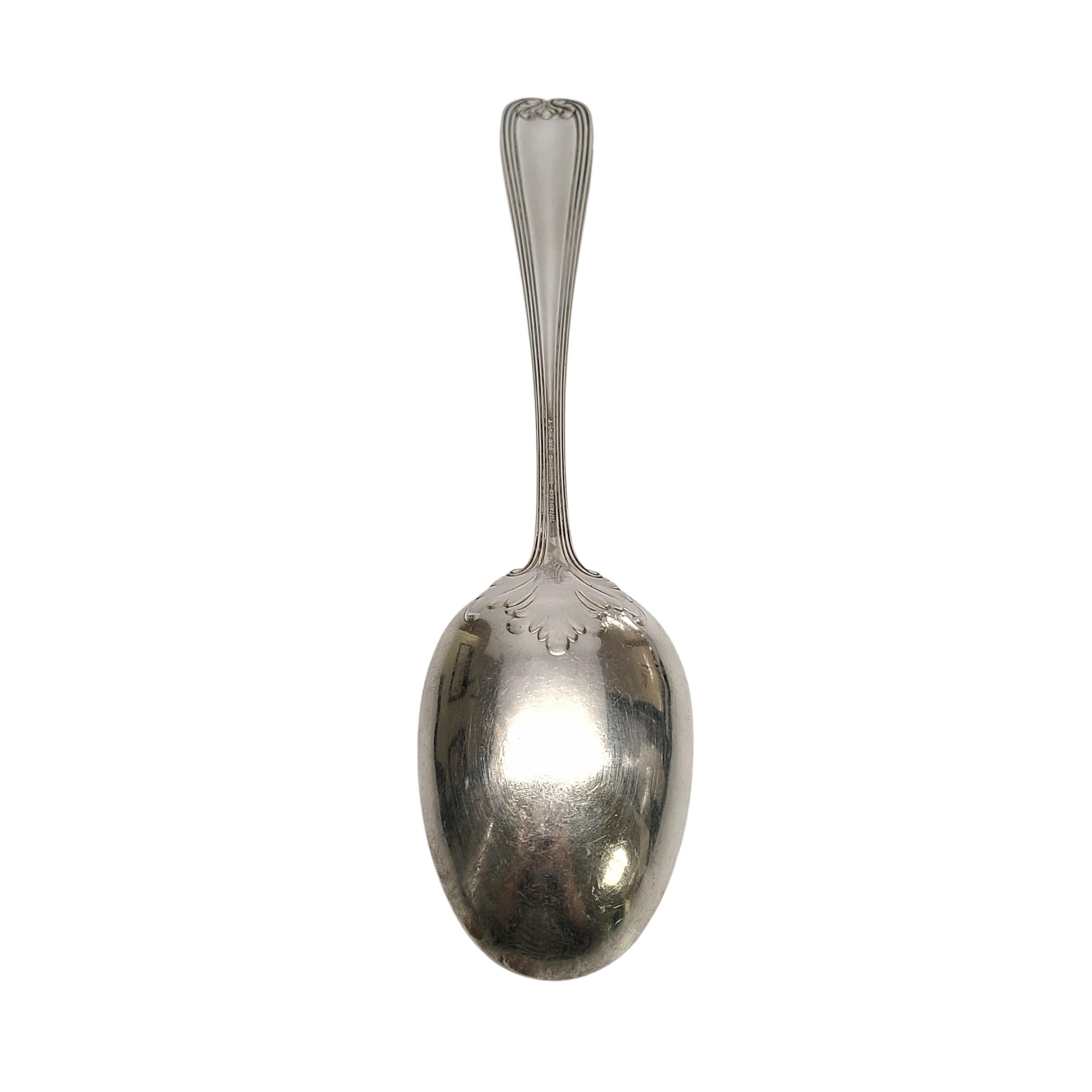 Sterling silver vegetable serving spoon by Tiffany & Co in the Colonial pattern.

Monogram appears to be McK

A large vegetable spoon in the Colonial pattern, designed by Paulding Farnham in 1895, features a simple scroll and leaf design on the
