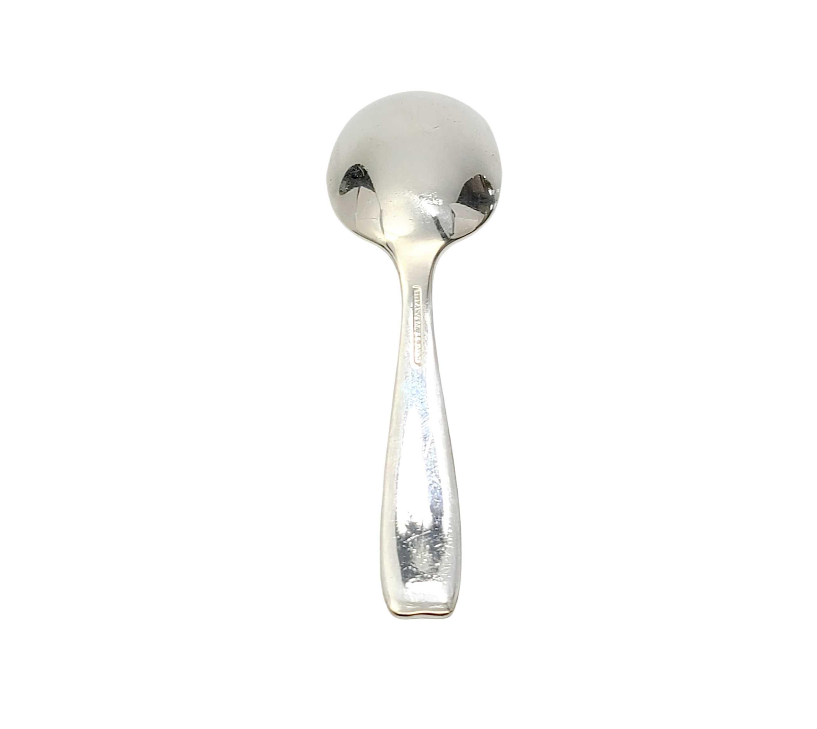Tiffany & Co. sterling silver baby feeding spoon in the Cordis pattern.

Cordis is a simple and Classic design. No monogram or engraving. Does not include Tiffany & Co. box or pouch. The M mark on this spoon dates it to manufacture under the