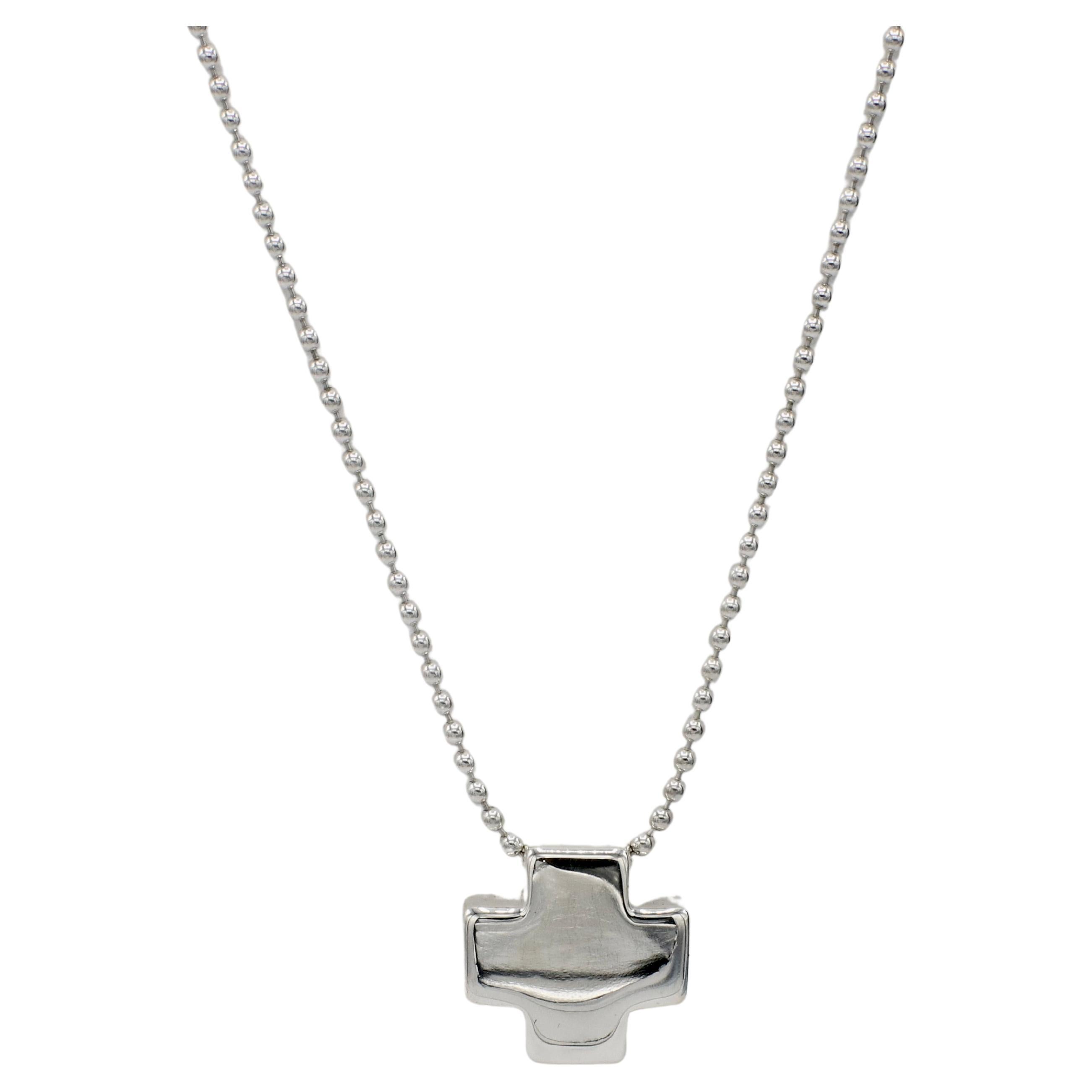 Tiffany & Co. Sterling SIlver Cross Pendant Necklace on Bead Chain 
Metal: Sterling silver 925
Weight: 13.79 grams
Cross: 17 x 17mm
Chain length: 15.5 inches
Chain width: 2mm
Signed: Tiffany & Co. 925 ITALY
