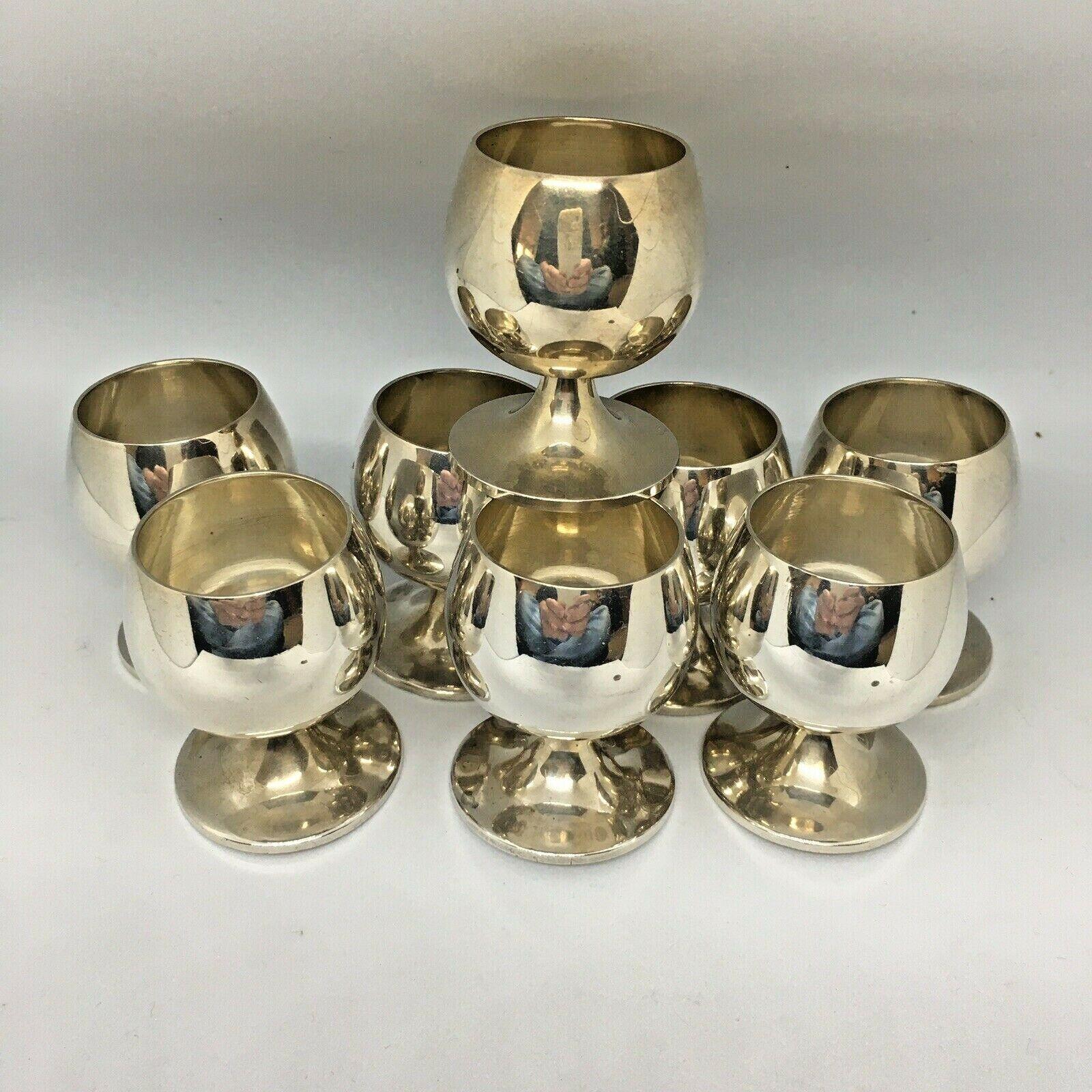 Tiffany & Co Sterling Silver Cup Shot Glass & Tray Set 

Marked 22595L on Cups and 23336 on Tray
Total weight of 497 gram
Cup base diameter 1 1/2 inch, 2 inch tall
Tray at 6 inch diameter
Normal wear and tear, no damage, none personalized, no