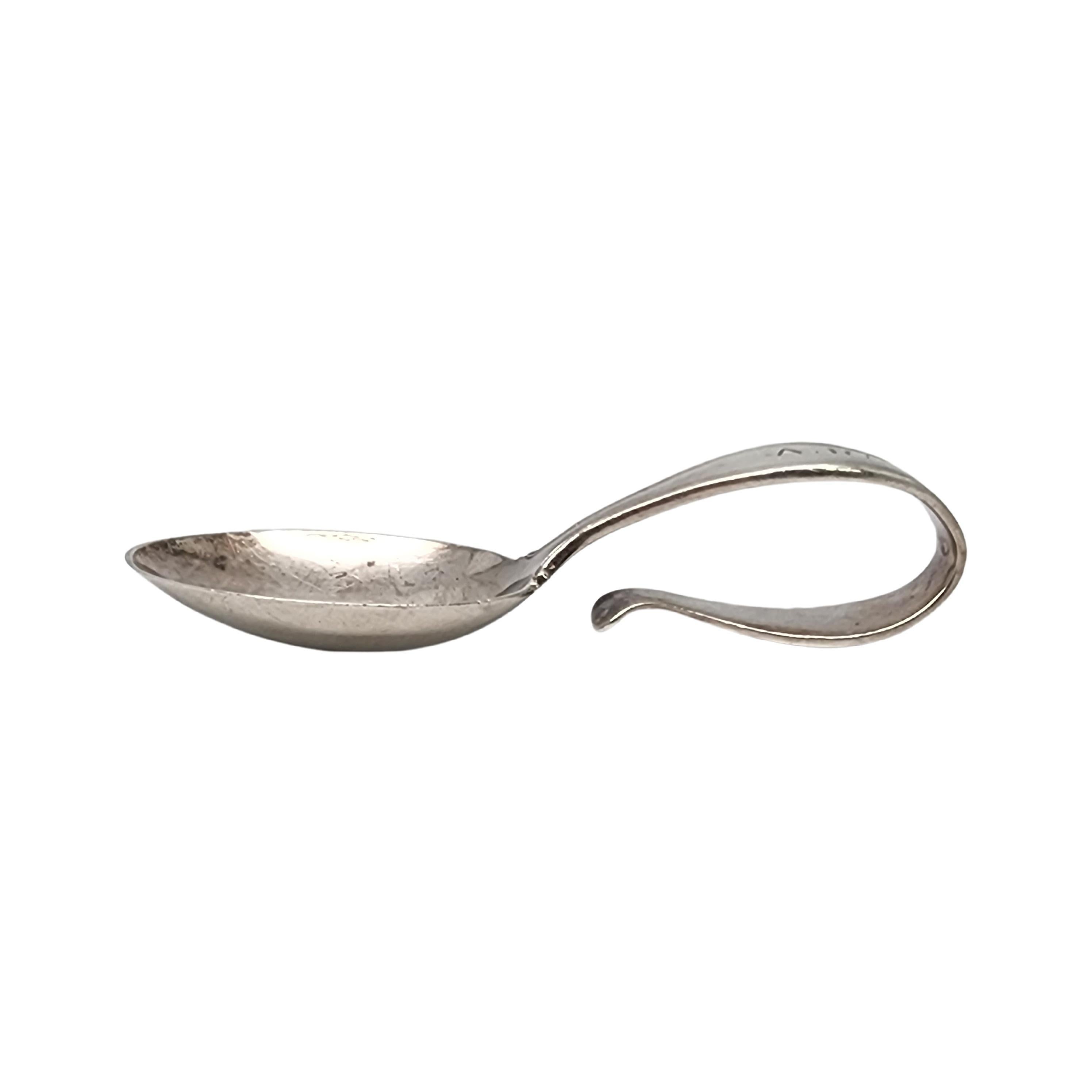 Sterling silver baby spoon with curved loop handle by Tiffany & Co with monogram.

Monogram appears to be AR

Timeless small baby/child feeding spoon featuring a curved loop handle. Hallmarks date this piece to manufacture under the directorship of