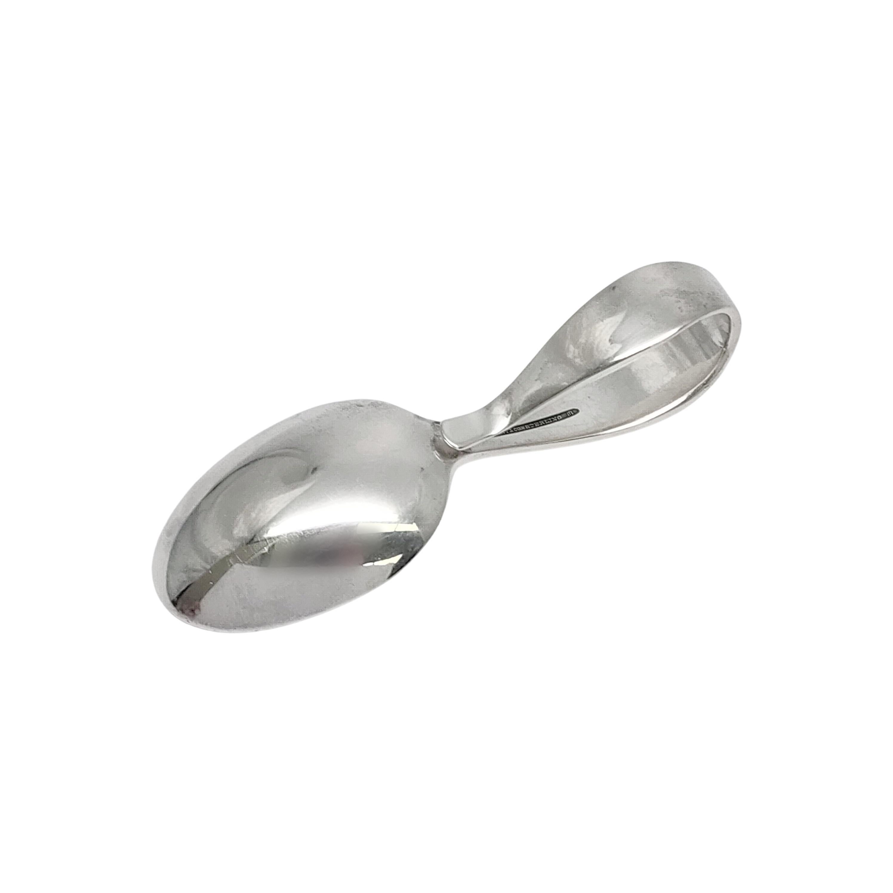 Sterling silver baby spoon with curved loop handle by Tiffany & Co with monogram.

Monogram appears to be LBS (see photos)

Timeless small baby/child feeding spoon featuring a curved loop handle. Hallmarks date this piece to manufacture under the