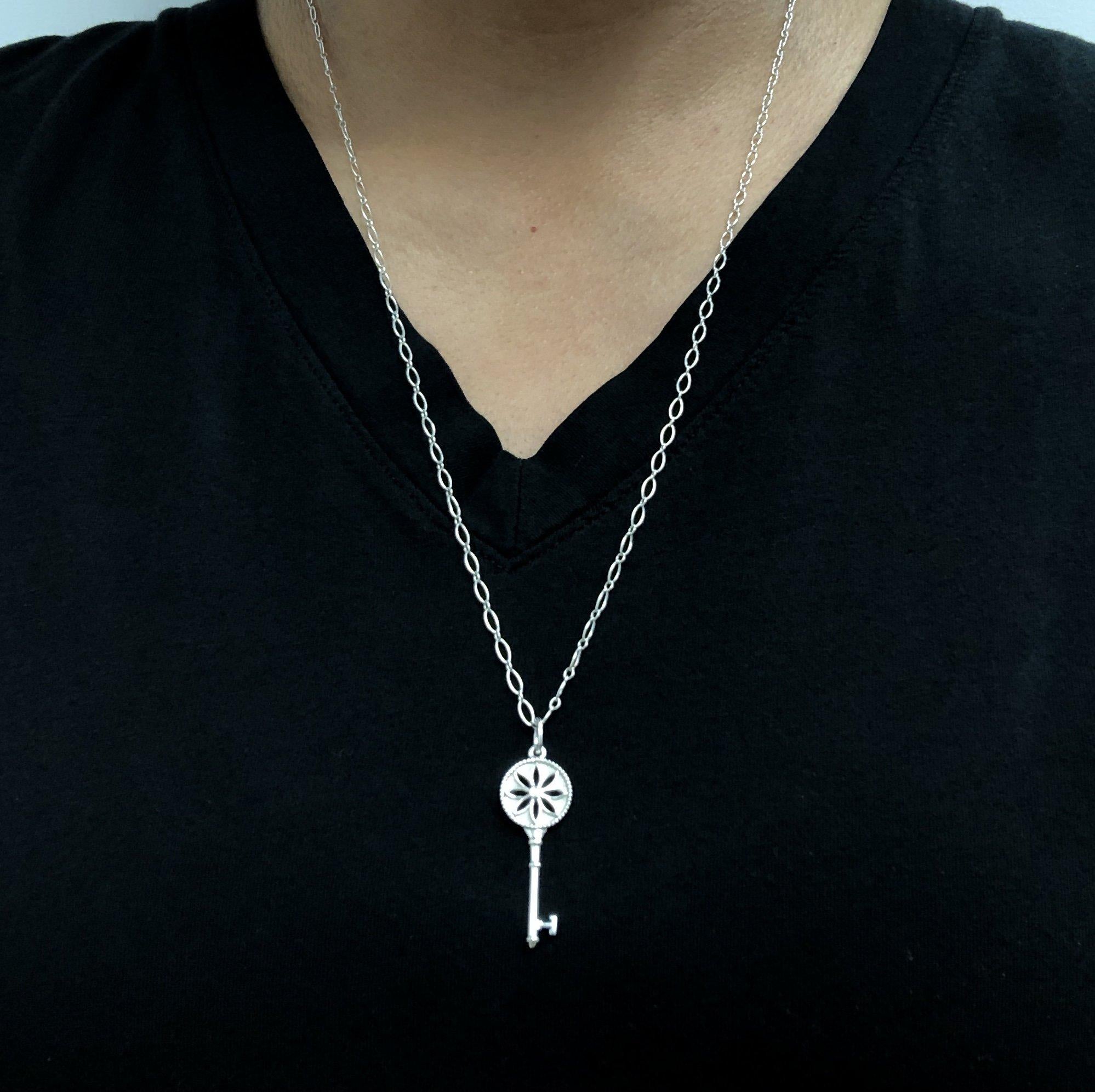 Modern Tiffany & Co. Sterling Silver Daisy Key Pendant Necklace with Diamond