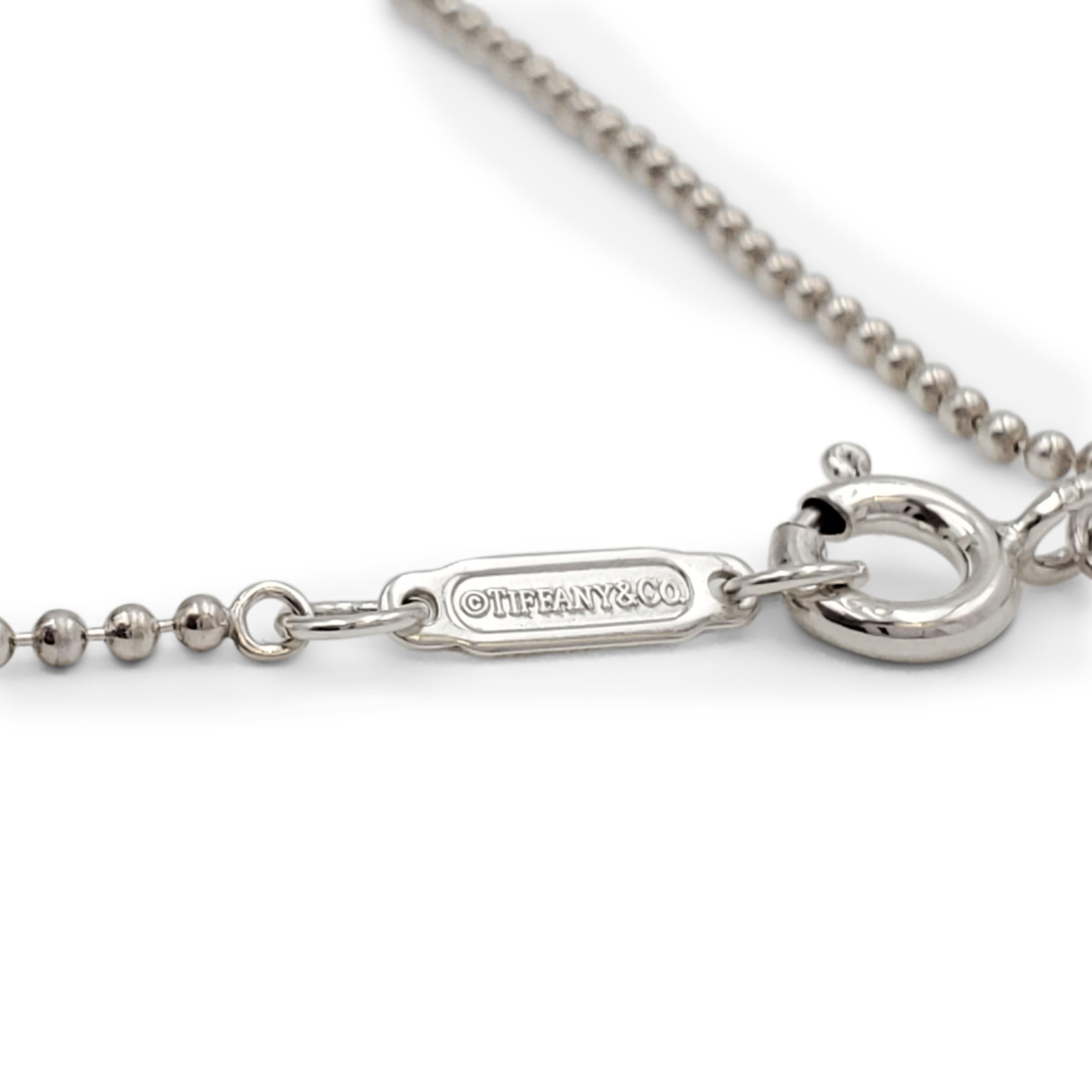 Tiffany & Co. Sterling Silver 'Daisy Key' Pendant on Beaded Chain In Excellent Condition In New York, NY