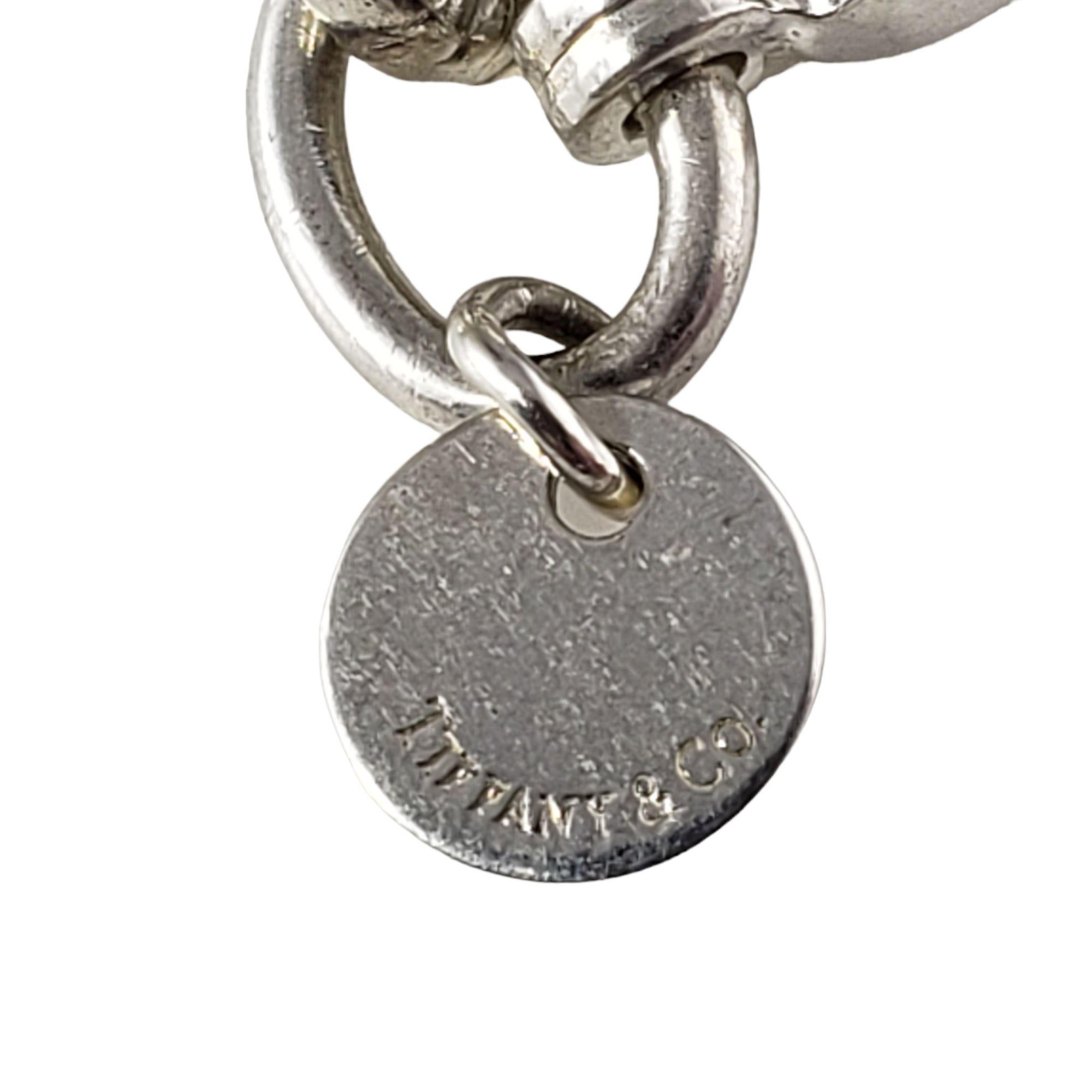 Vintage Tiffany & Co. Sterling Silver Dogwood Blossom Charm Bracelet-

This lovely link bracelet features a dangling dogwood blossom charm beautifully crafted in sterling silver by Tiffany & Co. Bracelet.
Width: 7 mm.

Matching earrings: