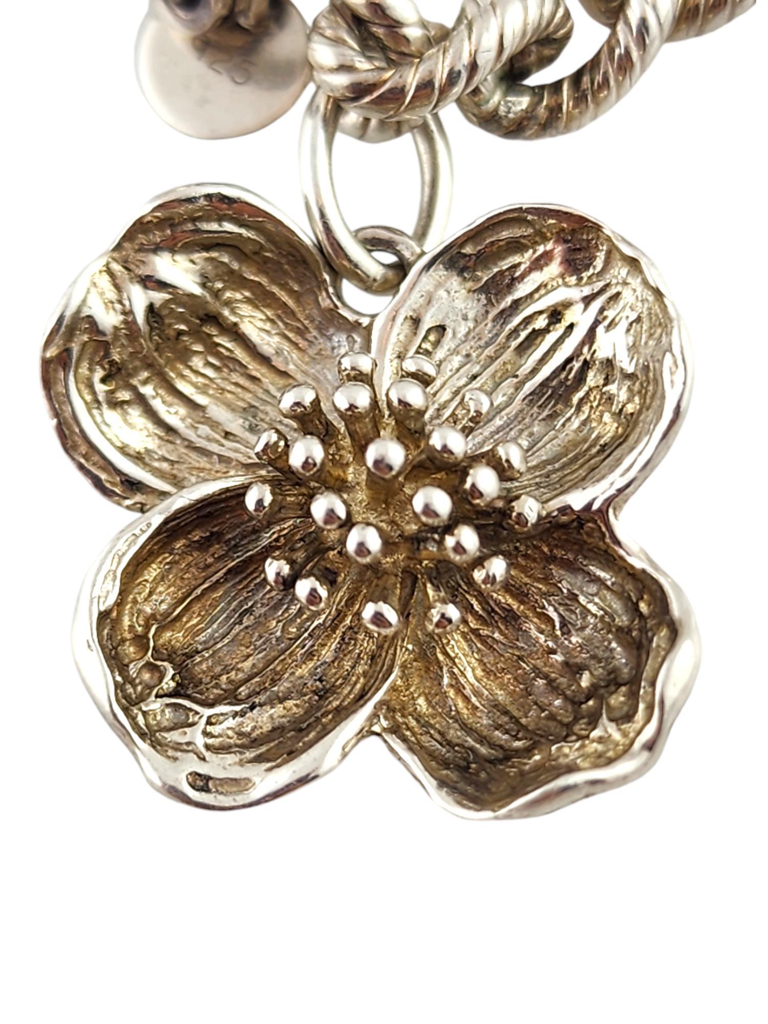 Tiffany & Co Sterling Silver Dogwood Flower Charm Bracelet 

This gorgeous charm bracelet features a beautiful dogwood flower charm meticulously crafted from sterling silver by amazing designer Tiffany & Co!

Size: 6 3/4