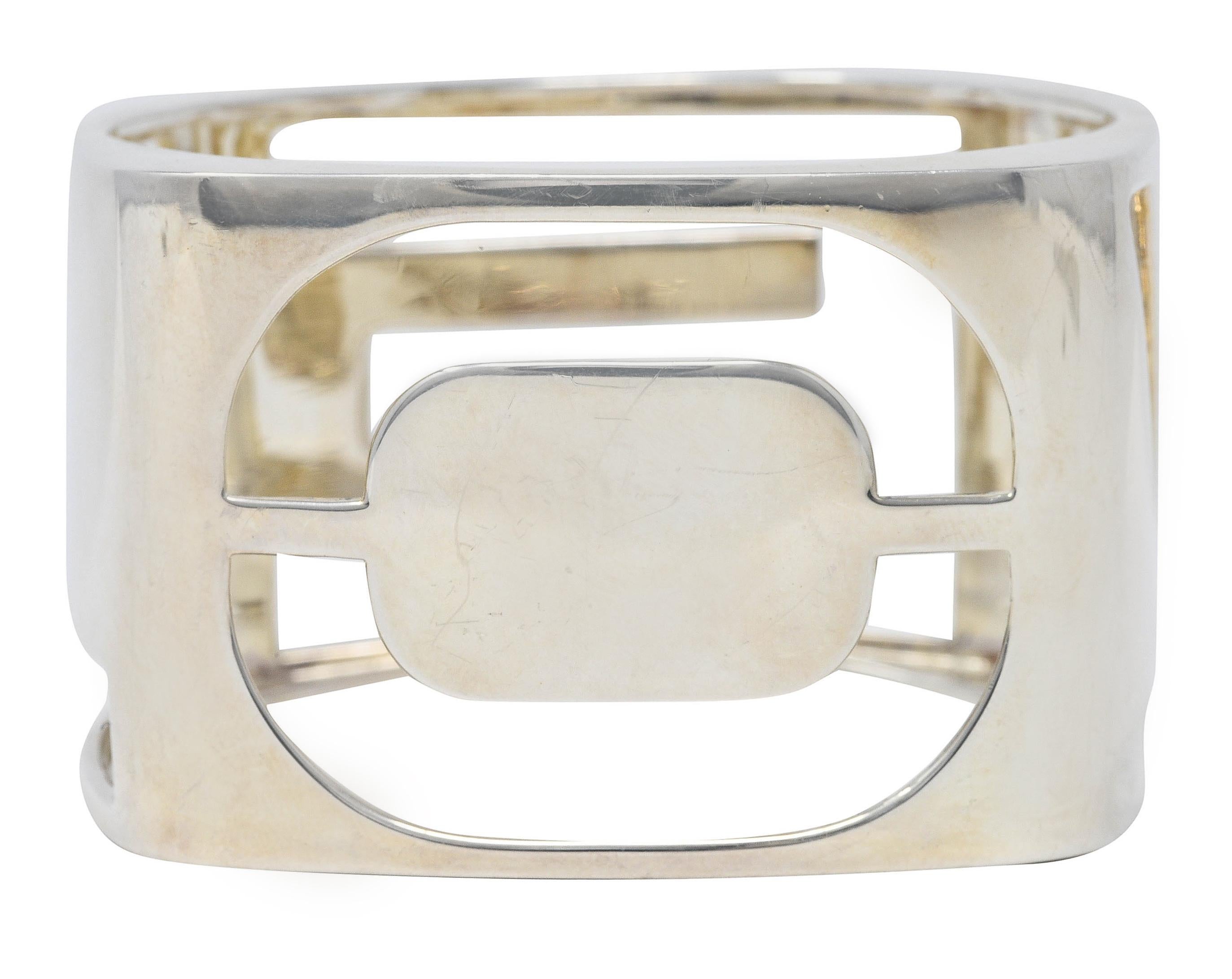 Wide rounded square form bangle bracelet featuring the word 'LOVE'

Centering a graphically pierced letter on each panel

With high polished finish

Stamped AG 925 for sterling silver

Fully signed Tiffany & Co.

From the Tiffany Love Era Collection