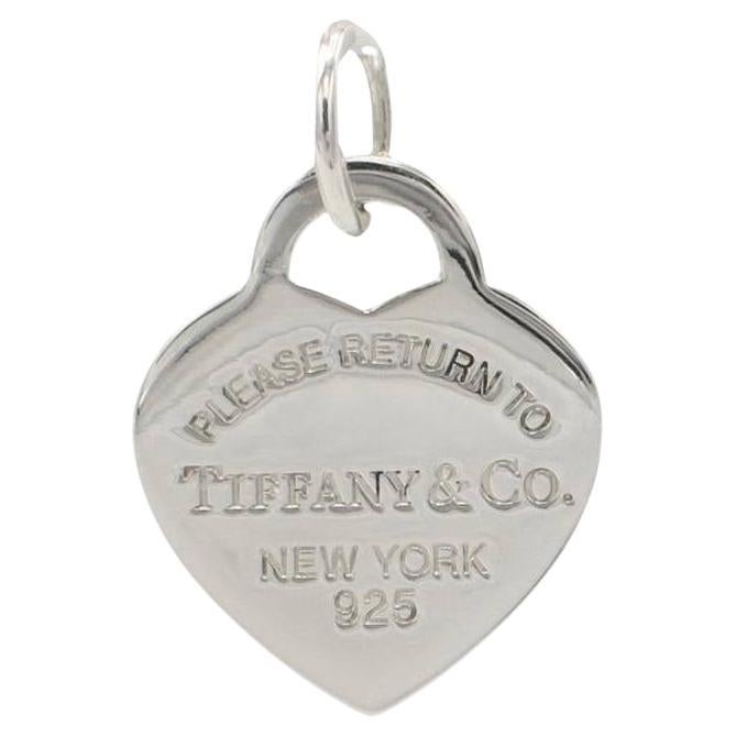 Tiffany & Co. Sterling Silver Enamel Heart Charm Return to Tiffany Pendant 
Metal: Sterling silver
Weight: 4.57 grams
Dimensions: 25 x 20mm
Bale opening: 5mm
Signed: Please Return to Tiffany & Co. New York 925 ©T&Co. AG925
Note: Charm only (does not