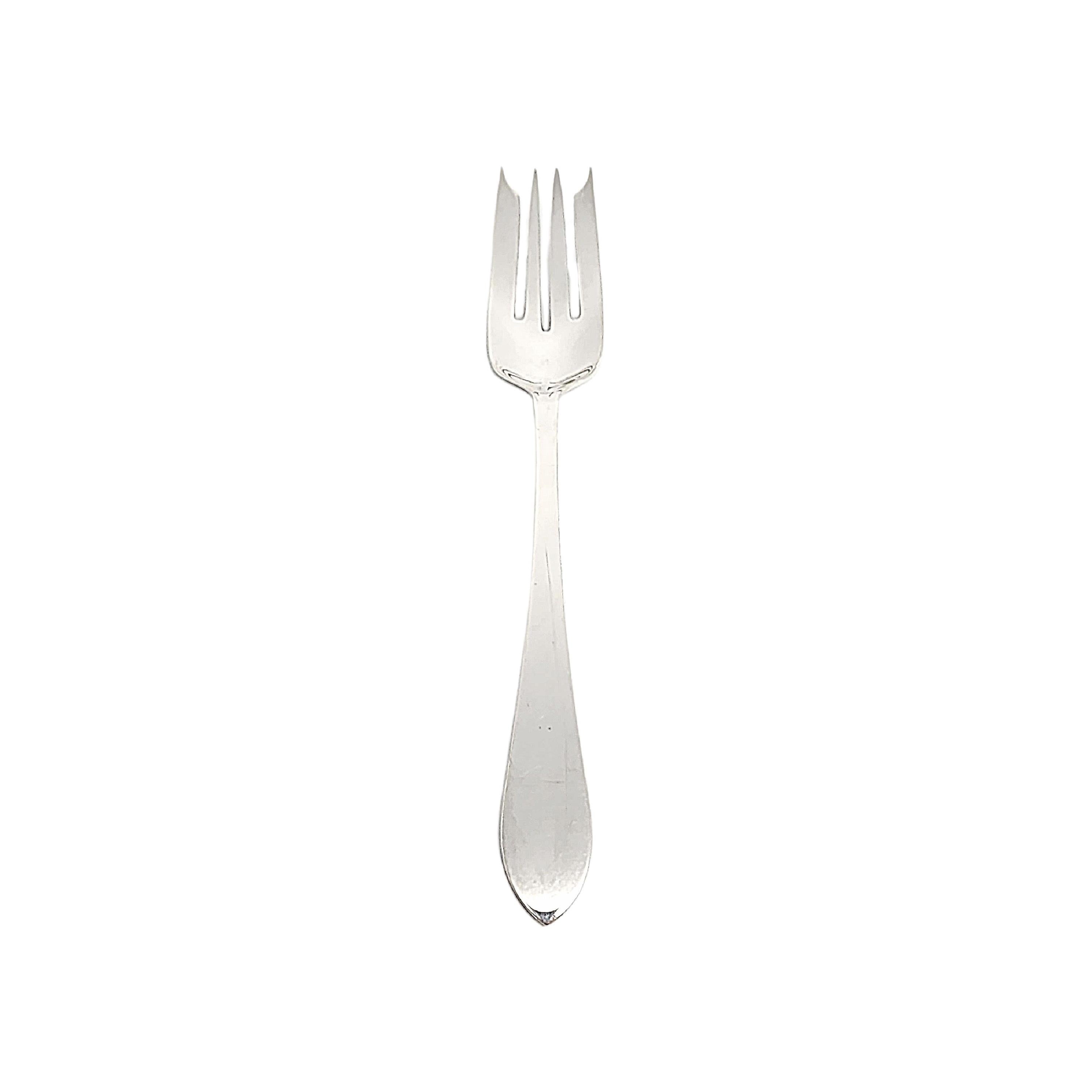 Tiffany & Co sterling silver salad fork in the Faneuil pattern.

No monogram or engraving.

The Faneuil pattern was in production from 1910-1955 and was named for Faneuil Hall in Boston, MA. The pattern's simple and elegant design makes it a