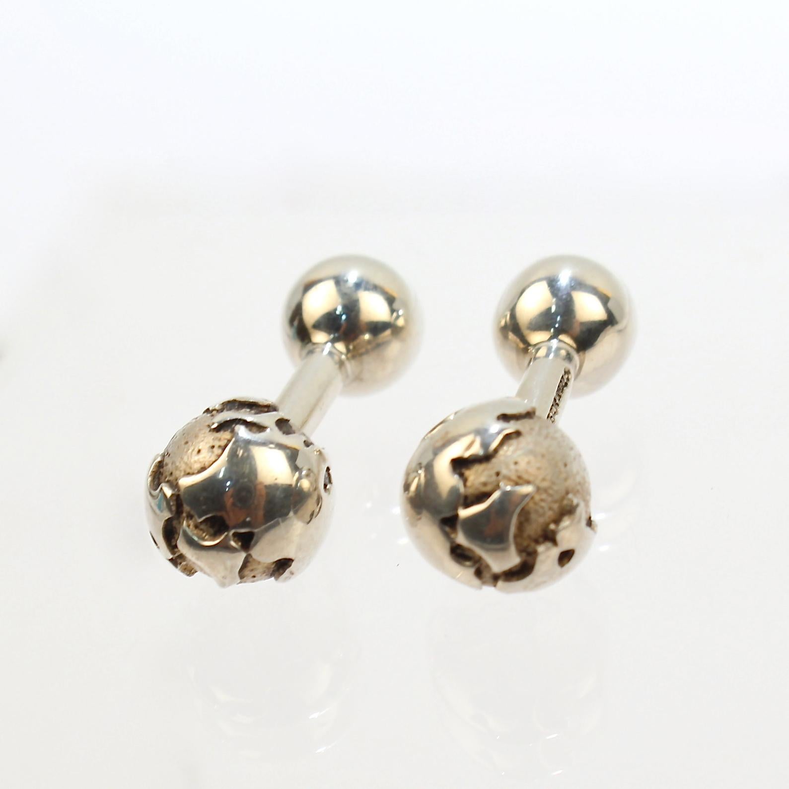 A fine pair of Tiffany & Co. cufflinks.

These terrific barbell cufflinks have a globe on one end of each link.

Exciting Tiffany design!

Date:
20th Century

Overall Condition:
They are in overall good, as-pictured, used estate condition with some