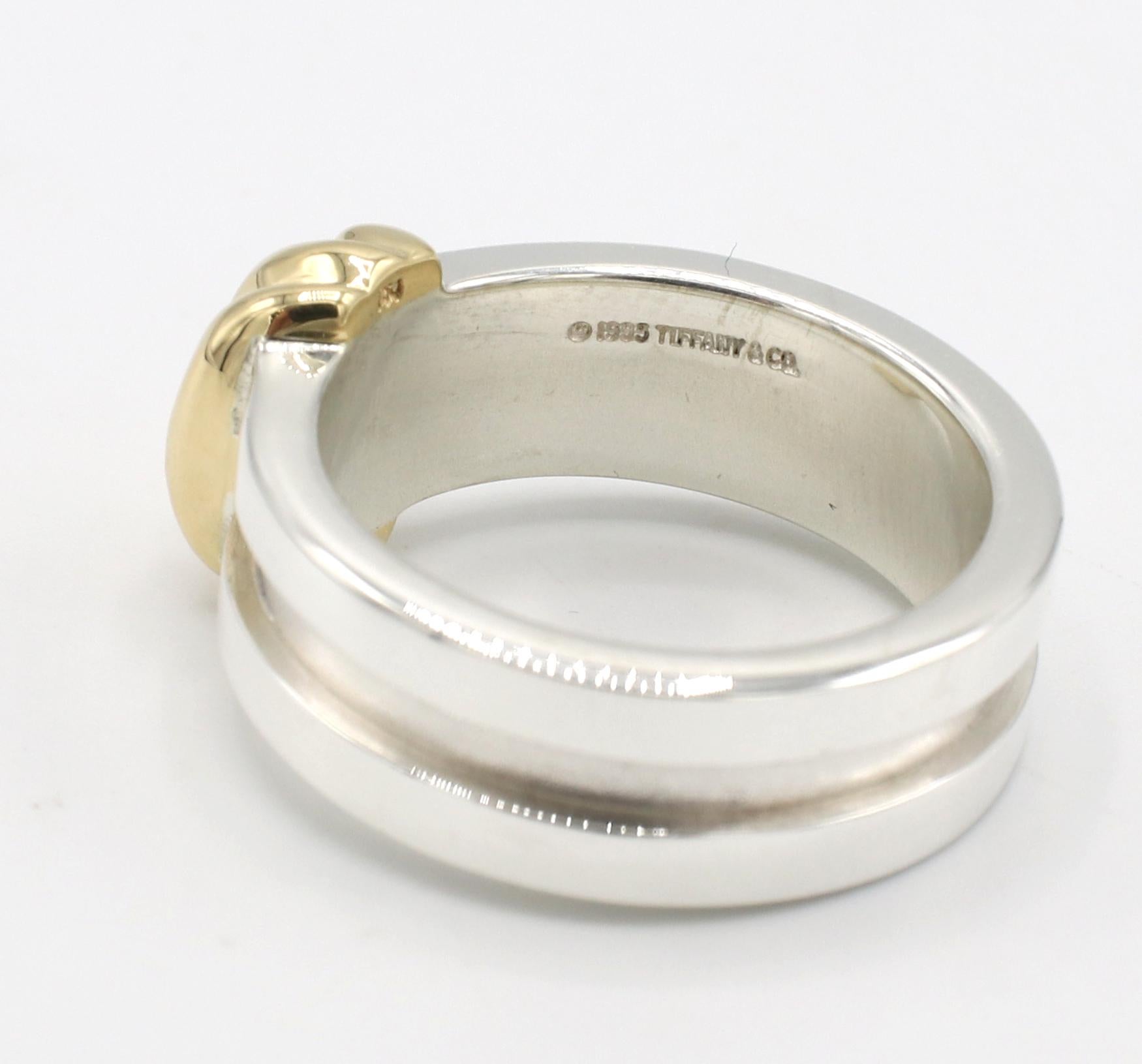 Tiffany & Co. Sterling Silver & Gold Band Ring 
Metal: Sterling silver & 18k yellow gold
Weight: 8.7 grams
Width: 7mm
Size: 6.5 (US)
Signed: ©1995 Tiffany & Co. 
