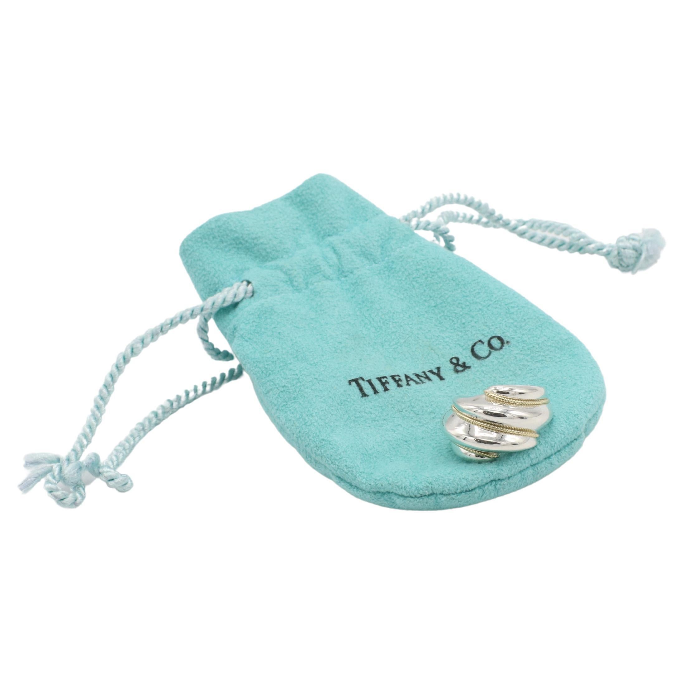 Tiffany & Co. Sterling Silver & Gold Rope Dome Band Ring 
Metal: Sterling silver & 18k yellow gold
Weight: 6.43 grams
Height: 6mm
Size: 5 (US)
Signed: Tiffany & Co. 925 750
