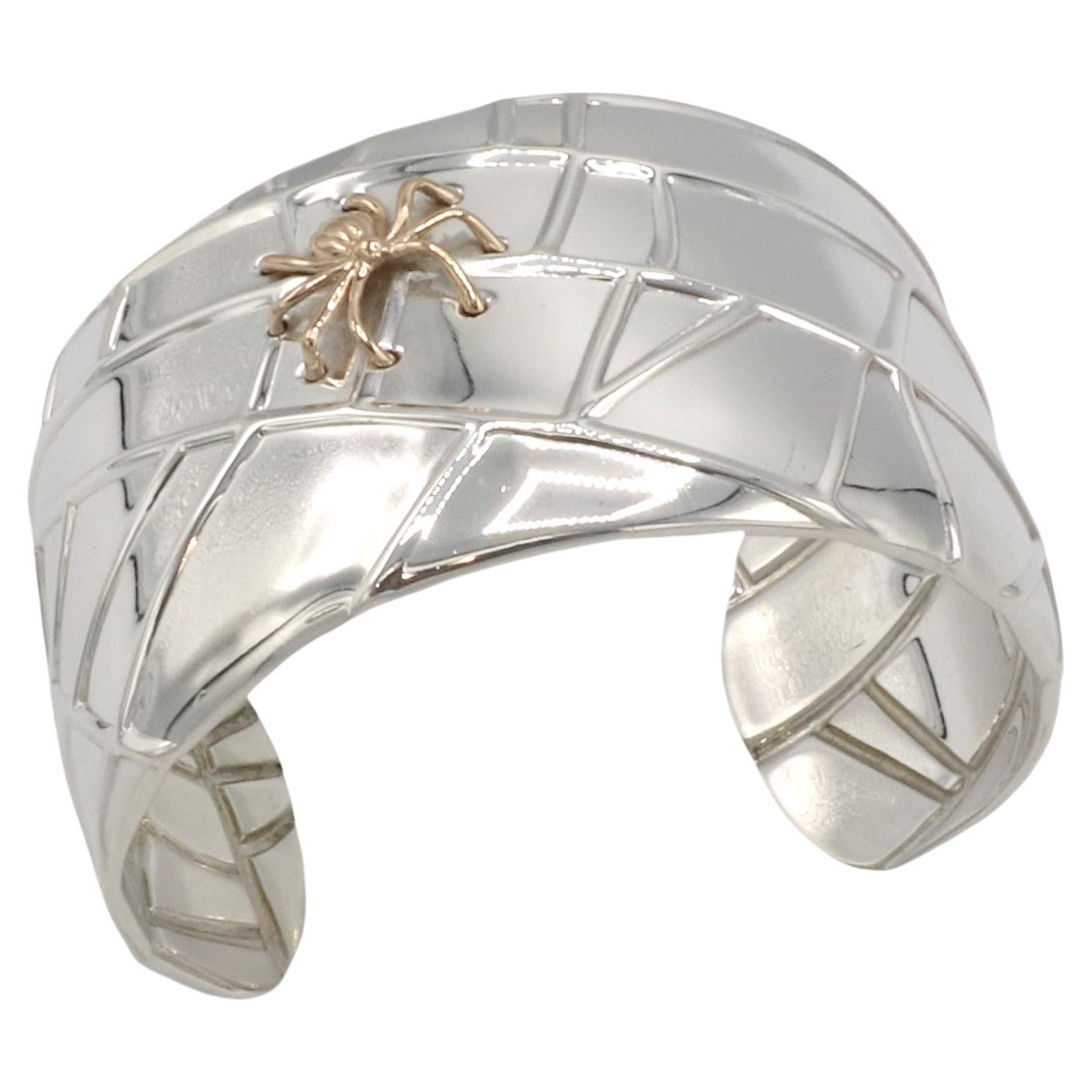 Tiffany & Co. Sterling Silver & Gold Spider Cuff Bracelet 
Metal: Sterling silver, 18k gold
Weight: 92.07 grams
Width: 38mm
Diameter: 60mm
Circumference: Approx. 7 inches