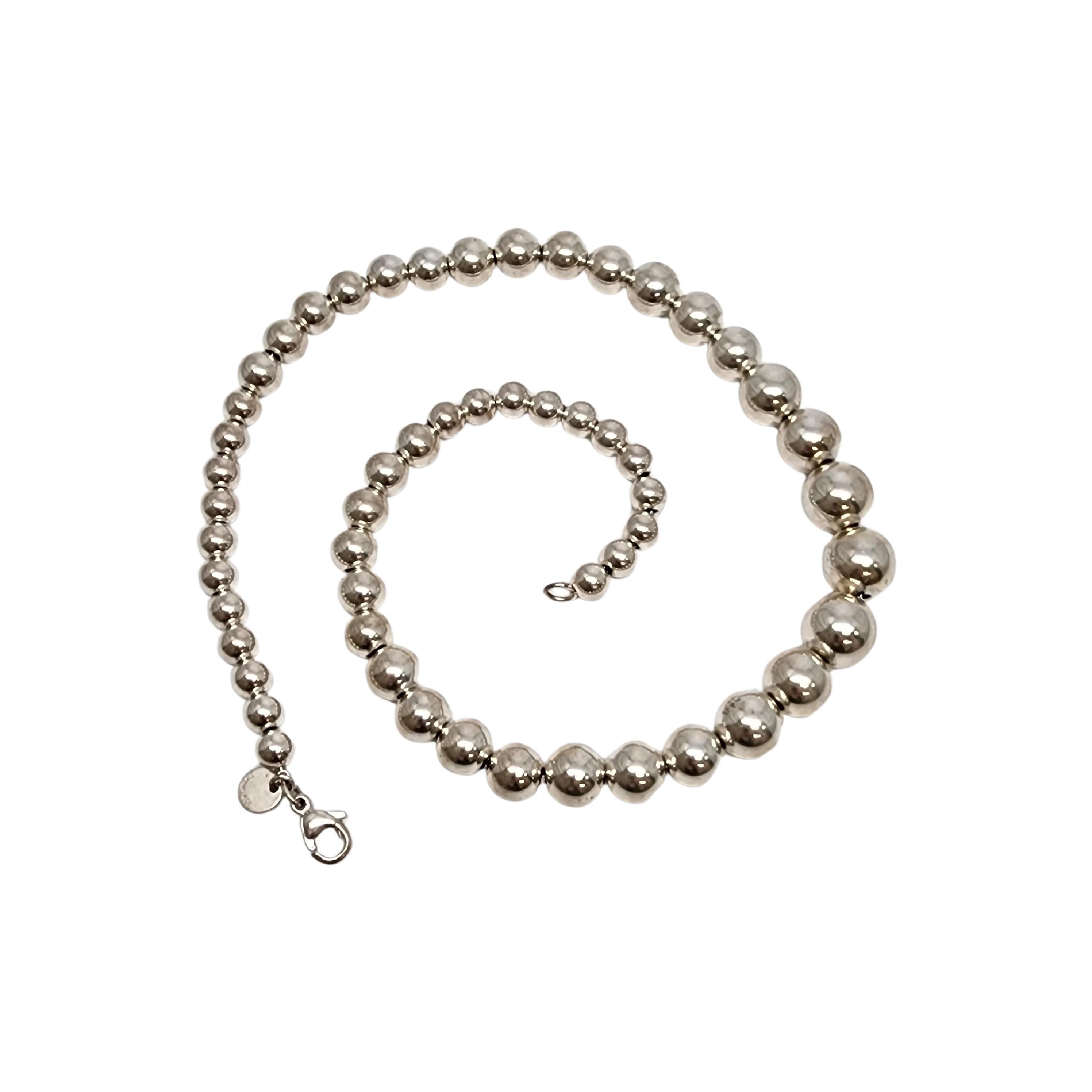 Sterling silver graduated ball bead necklace by Tiffany & Co.

Authentic Tiffany bracelet featuring sterling silver ball beads that are wider in the middle and get smaller towards the ends. Tiffany pouch and box are not included.

Measures approx