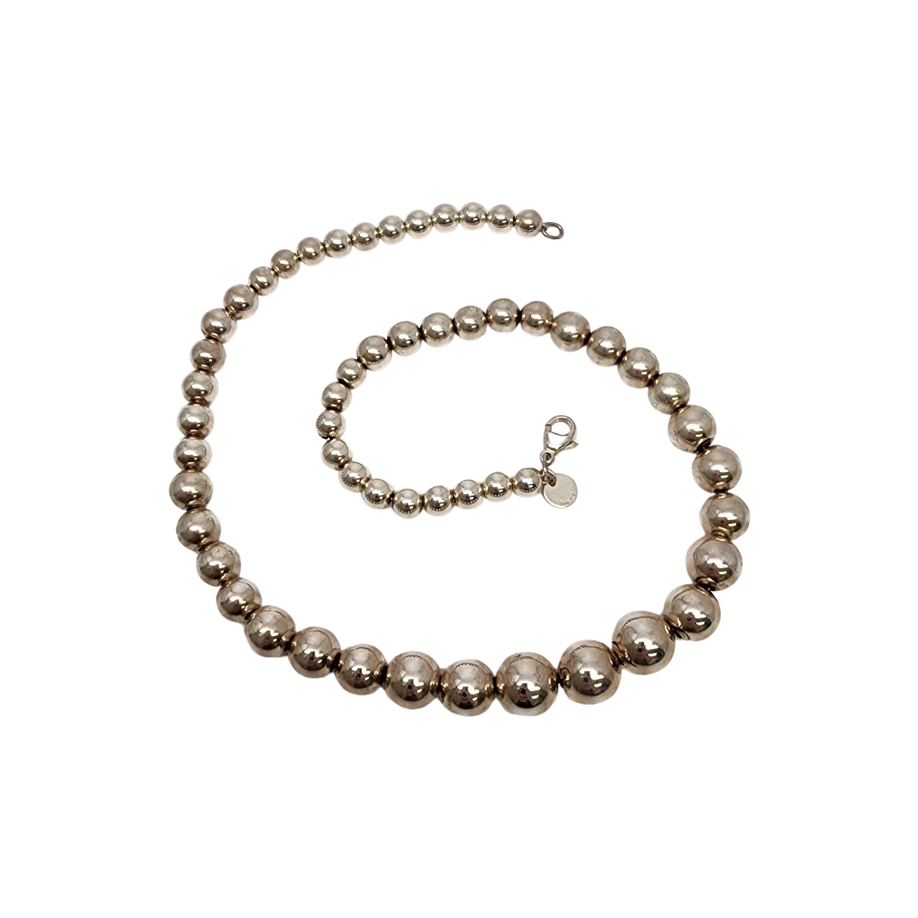 Sterling silver graduated ball bead necklace by Tiffany & Co.

Authentic Tiffany bracelet featuring sterling silver ball beads that are wider in the middle and get smaller towards the ends. Tiffany pouch and box are not included.

Measures approx