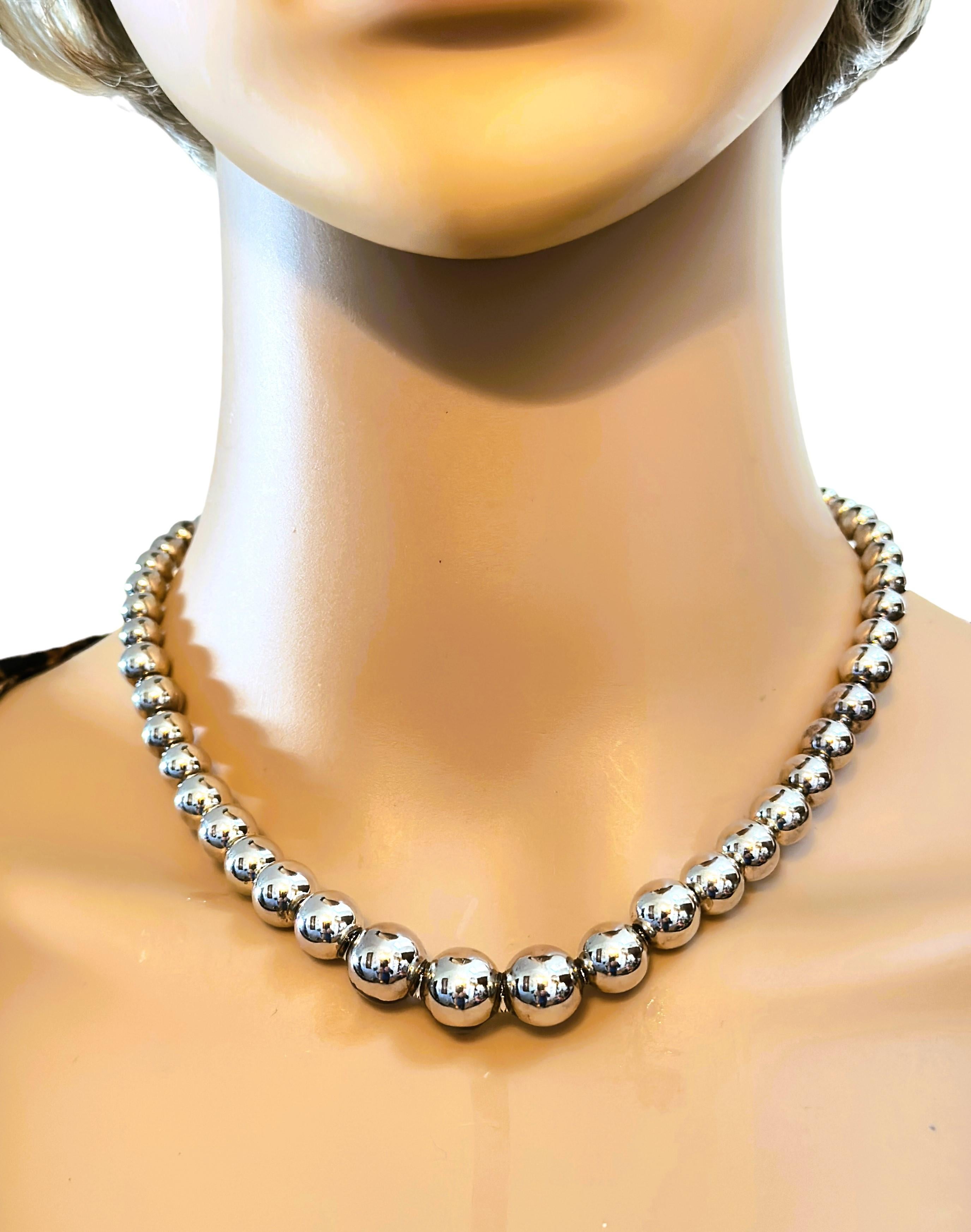 This is just a beautiful High Polish Tiffany necklace.  The sterling silver just glows on it.  It is pre-owned and in excellent condition.  At the clasp the smallest bead is 5.8 mm and it graduates to the largest bead in the center which measures