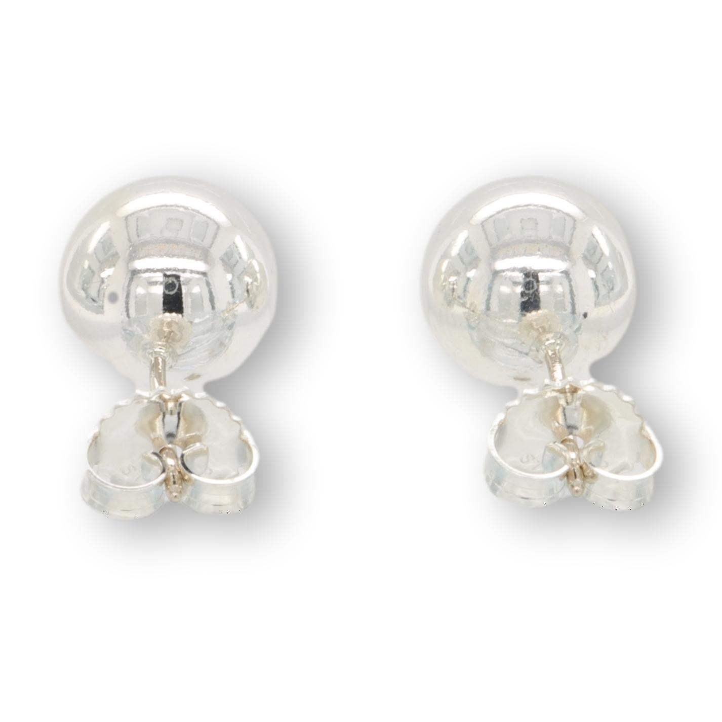 Tiffany & Co. ball stud earrings from the Hardware collection finely crafted in sterling silver measuring 10mm each. Posts with butterfly backs. Hallmarks are faded. 10mm each earring

Earrings Specifications
Brand: Tiffany & Co.
Hallmarks: