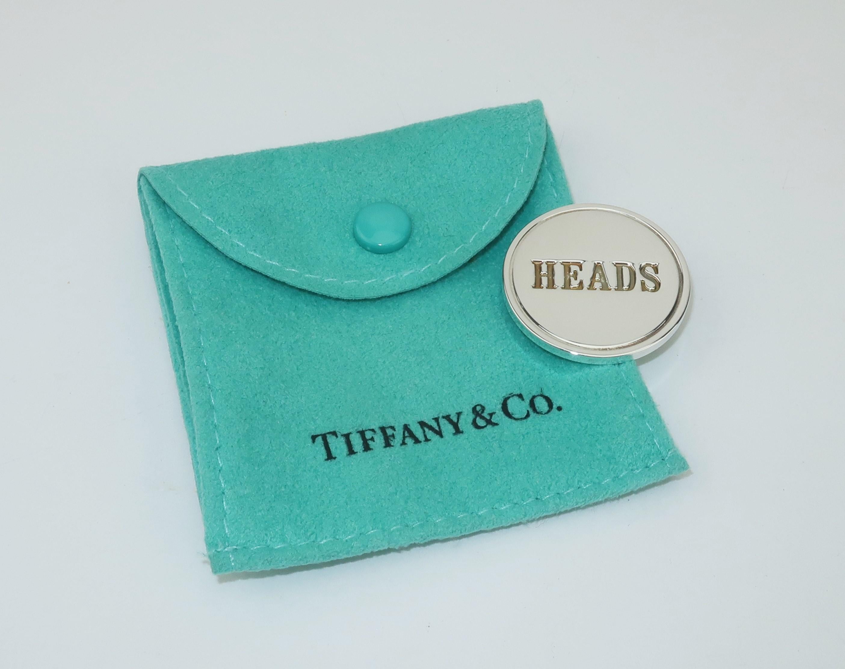 Either way you call it, this Tiffany & Co. sterling silver coin will always be a winner.  Cleverly embossed with 'Heads' on one side and 'Tails' on the other.  Measures 1.13