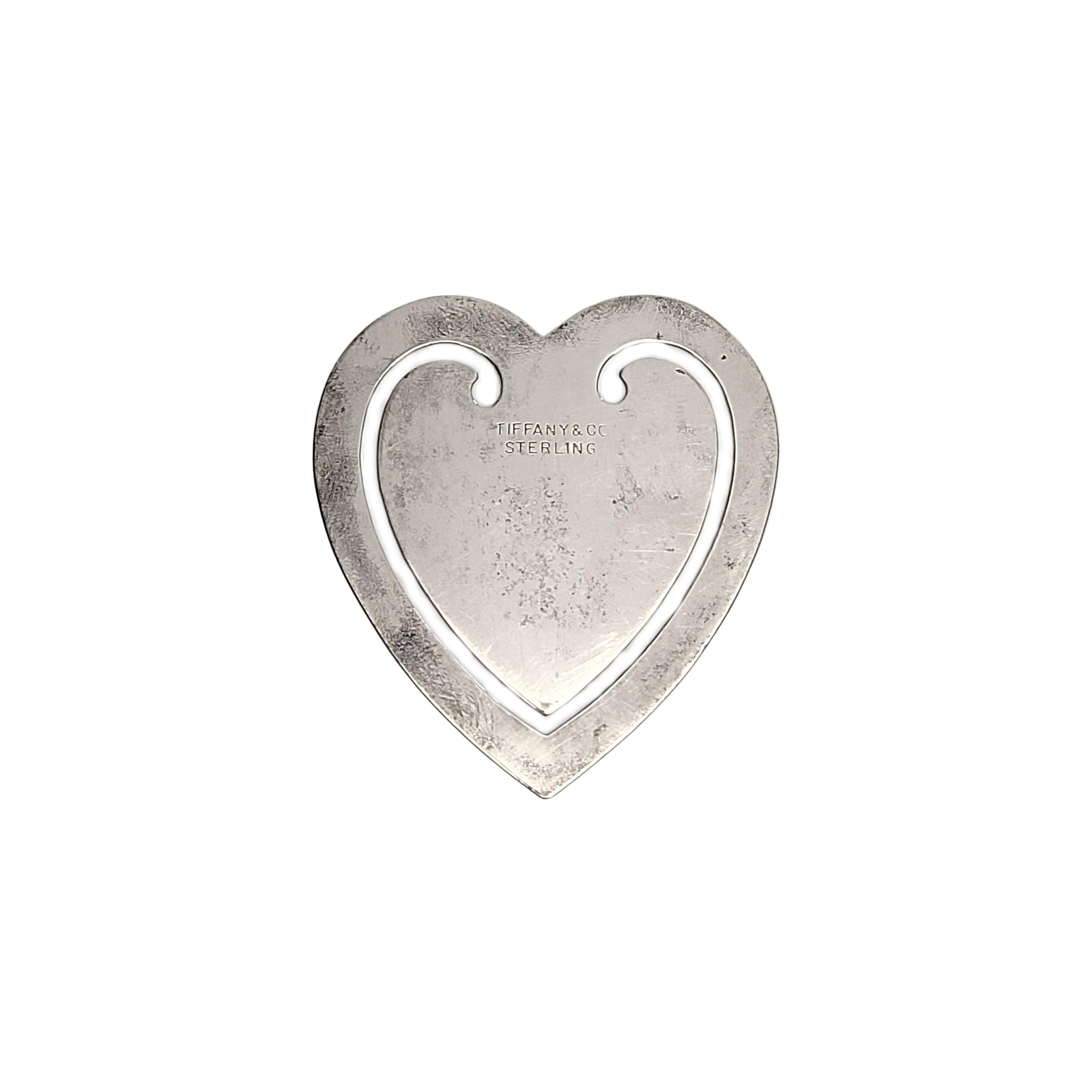 Tiffany & Co sterling silver heart bookmark.

Simple heart design, a perfect piece for any book lover. Does not include Tiffany & Co box or pouch.

Measures approx 2 1/4