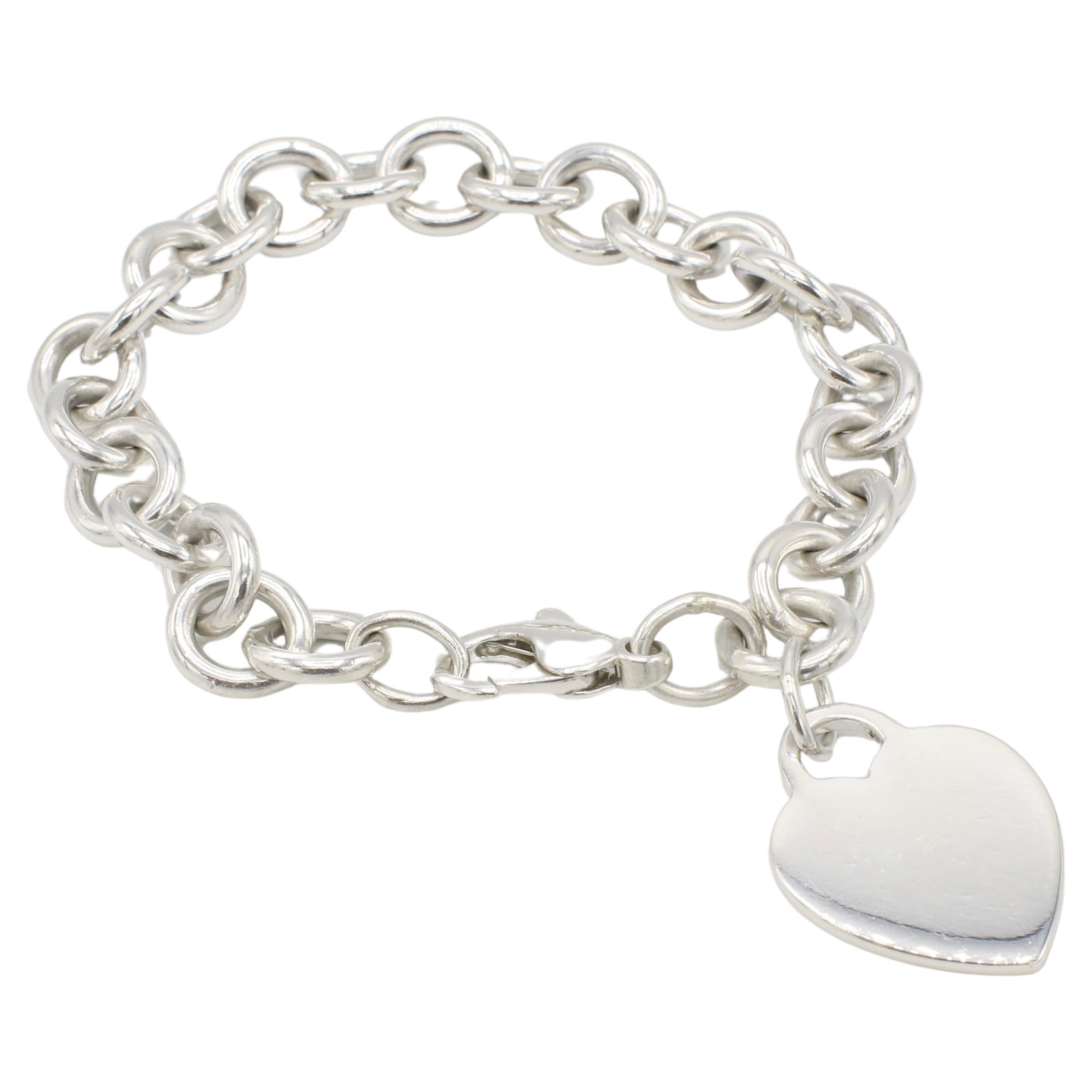 Tiffany & Co. Bracelet en argent sterling avec breloque en forme de coeur et lien circulaire 