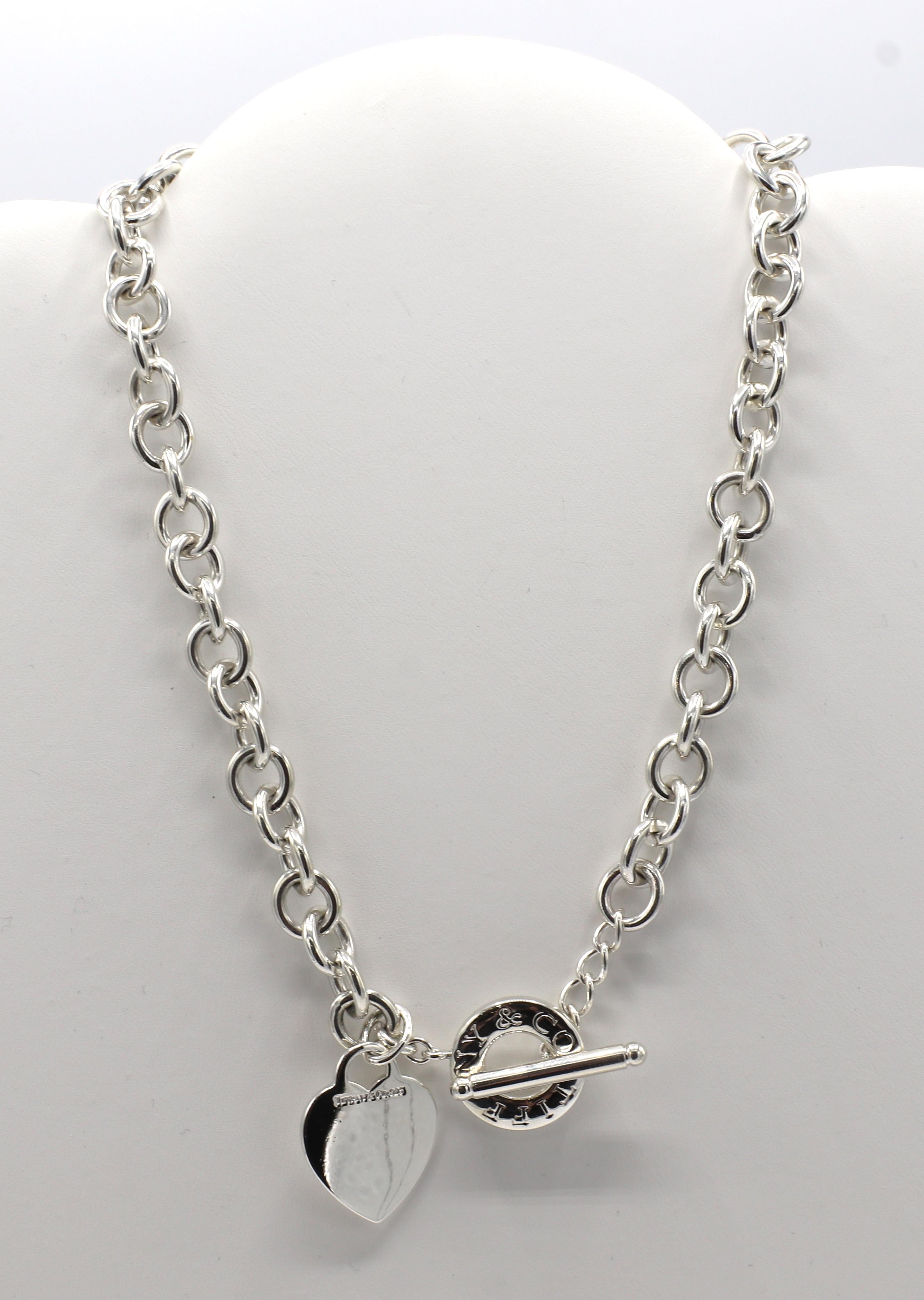 Tiffany & Co. Sterling Silver Heart Charm Toggle Link Chain Necklace 
Metal: Sterling silver 925
Weight: 74.78 grams
Length: 16 inches
Signed: Tiffany & Co. 925