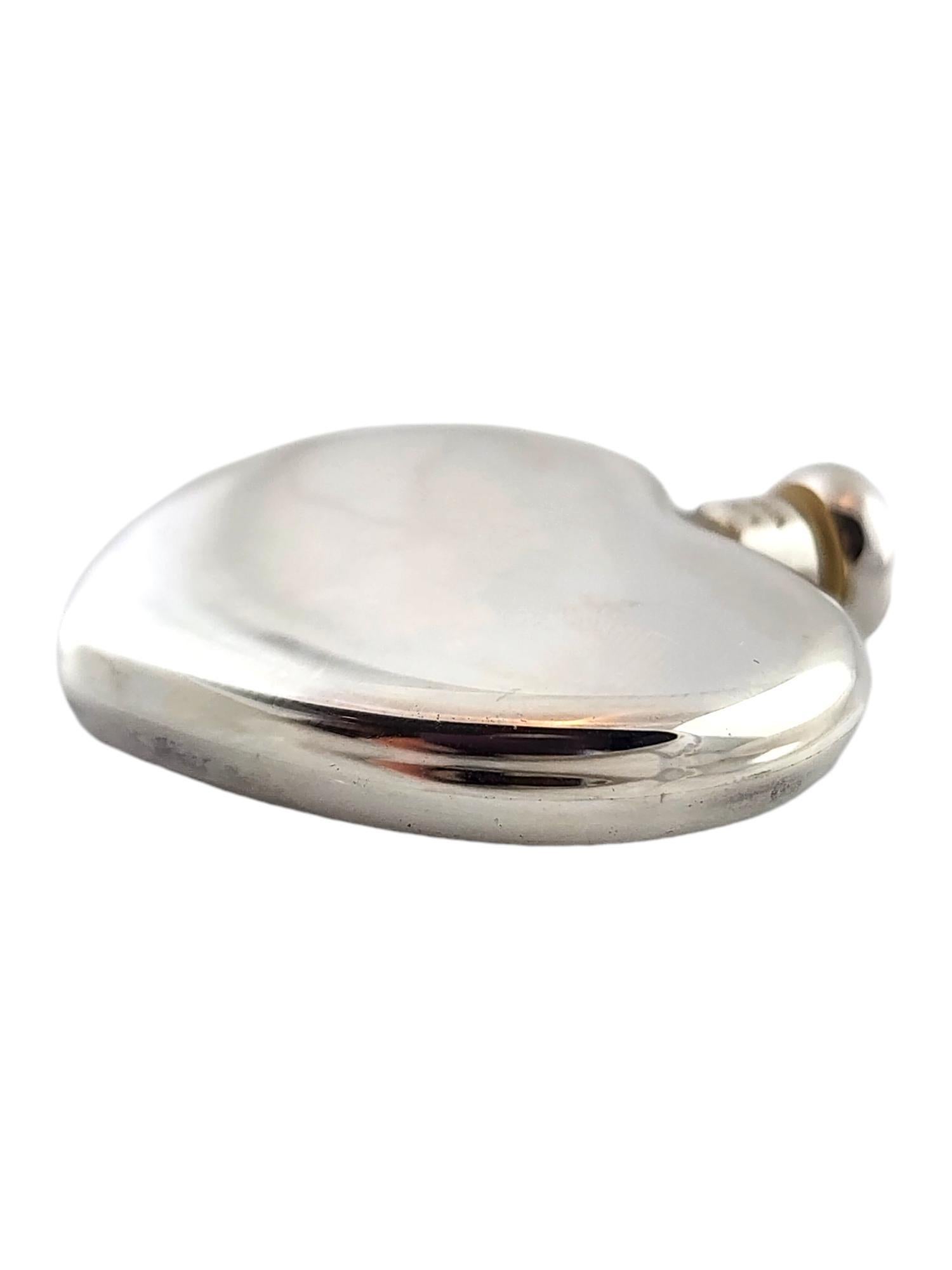 Tiffany & Co Sterling silver Heart Shaped Perfume Flask

This beautiful perfume flask by amazing designer Tiffany & Co was meticulously crafted from sterling silver in a gorgeous heart shape!

Approximate measurements: 1 5/8