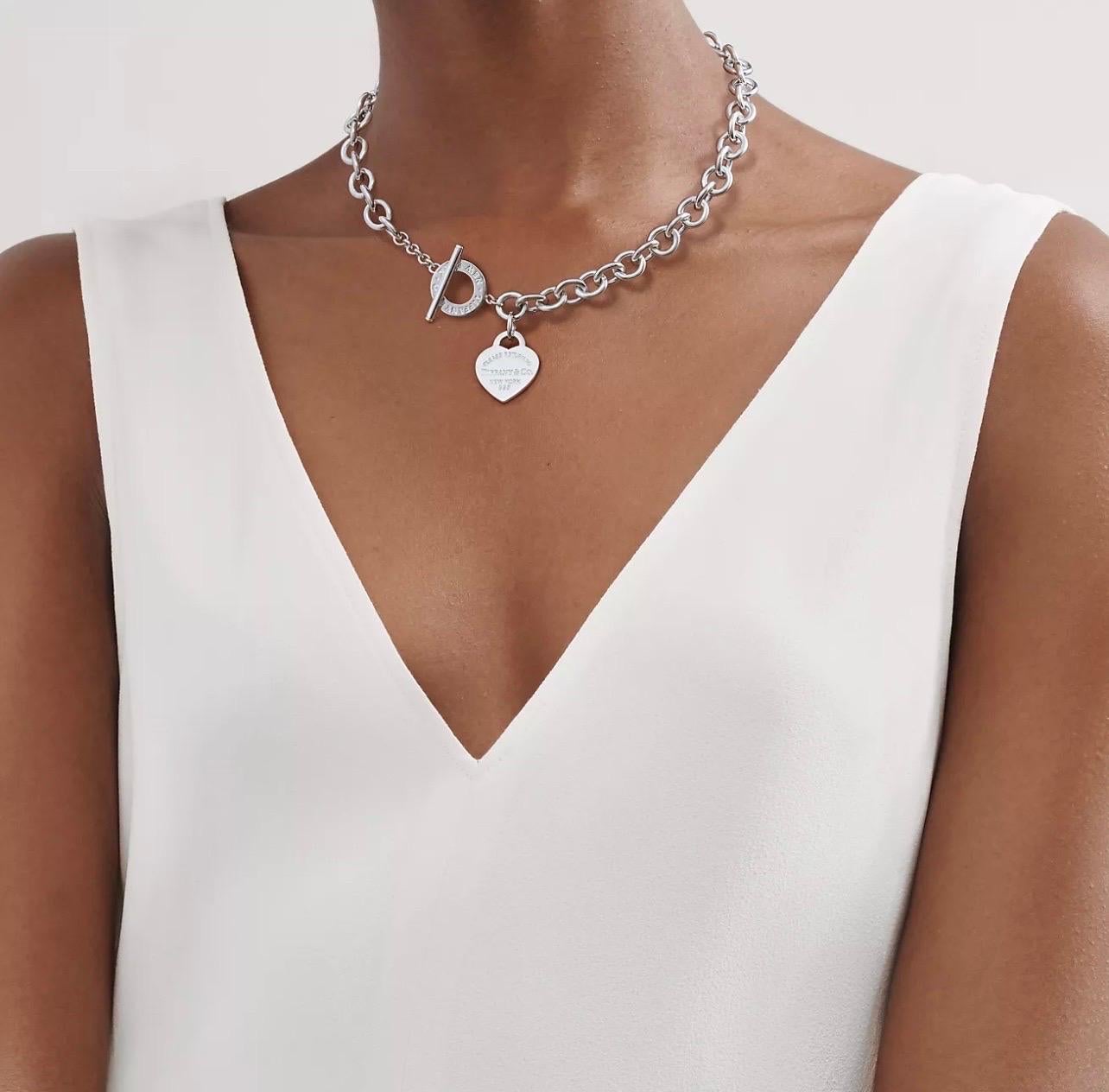Tiffany & Co. Sterling Silver Heart Tag Toggle Charm Necklace Tiffany & Co. Box, 75 Grams
An elite authentic bracelet from Tiffany & Co., forged from silver with a fine polished finish, it features a sturdy oval chain link bracelet with a solid