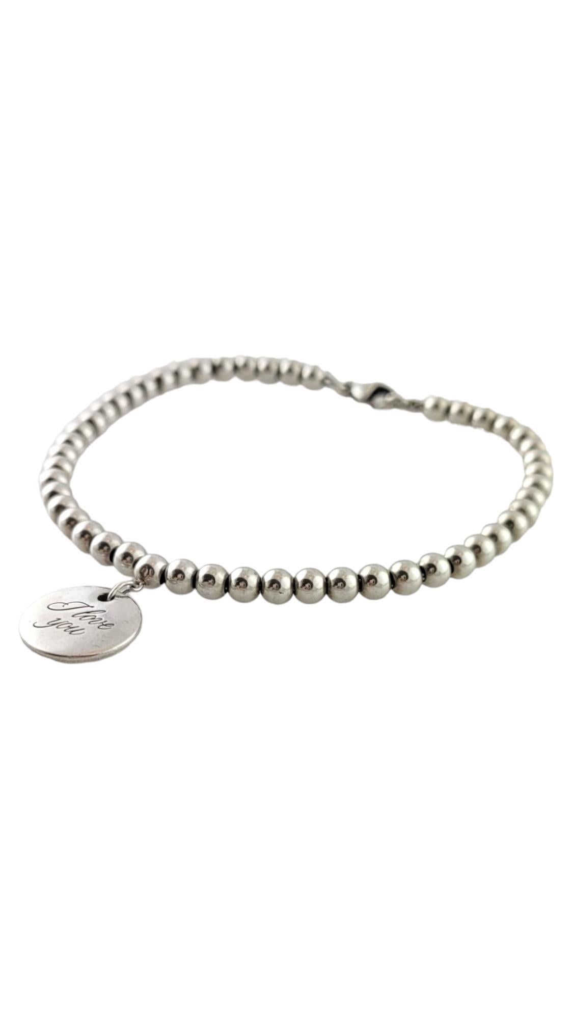 Tiffany & Co. Sterling silver I Love You Tag Bead Bracelet

This gorgeous piece by Tiffany & Co features a sterling silver bead bracelet with a beautiful sterling silver 