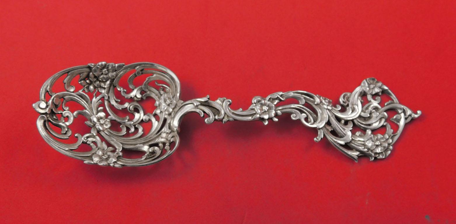 Tiffany & Co. sterling silver ice spoon with pierced flowers, 7 3/4