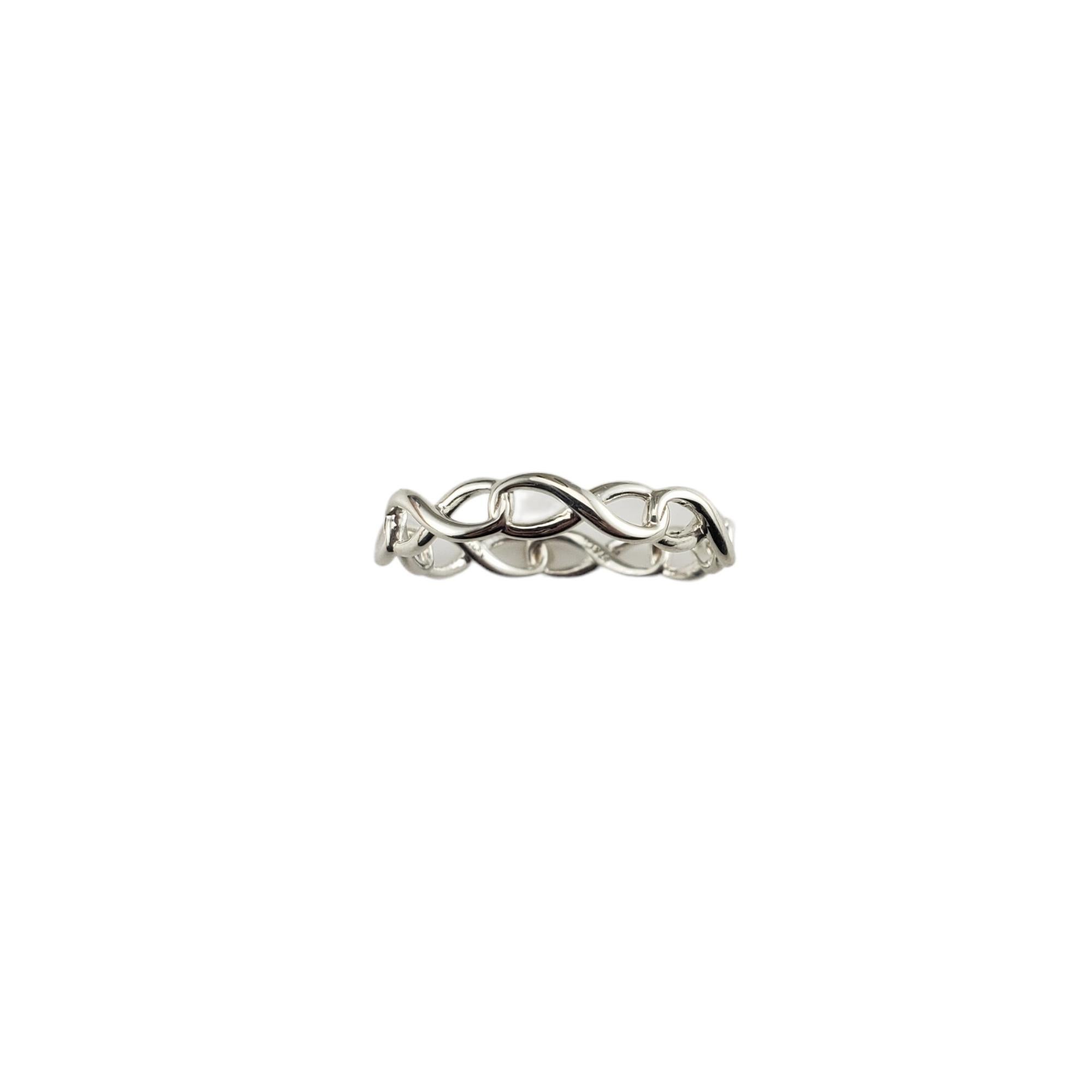 Vintage Tiffany & Co. Sterling Silver Infinity Band Ring Size 8-8.25--

This elegant infinity band by Tiffany & Co. is crafted in beautifully detailed sterling silver.  Width: 4 mm.

Ring size: 8-8.25

Hallmark:  T&CO.  925

Weight: 1.6 gr./ 1.0